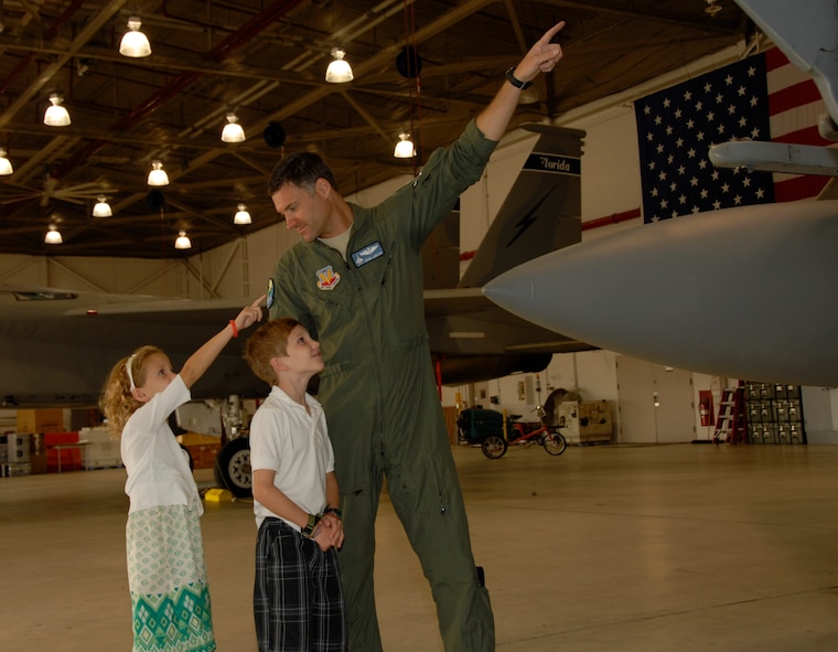 Major Adam Langton shows Preston Kilzer and his sister Kayli an F15 at the 125th Fighter Wing,Jacksonville Fla.  Preston and his family were in town with the Make A Wish Foundation and were given the opportunity to tour the base on September 13, 2010. (Air Force photo by Staff Sgt. Jaclyn Carver)