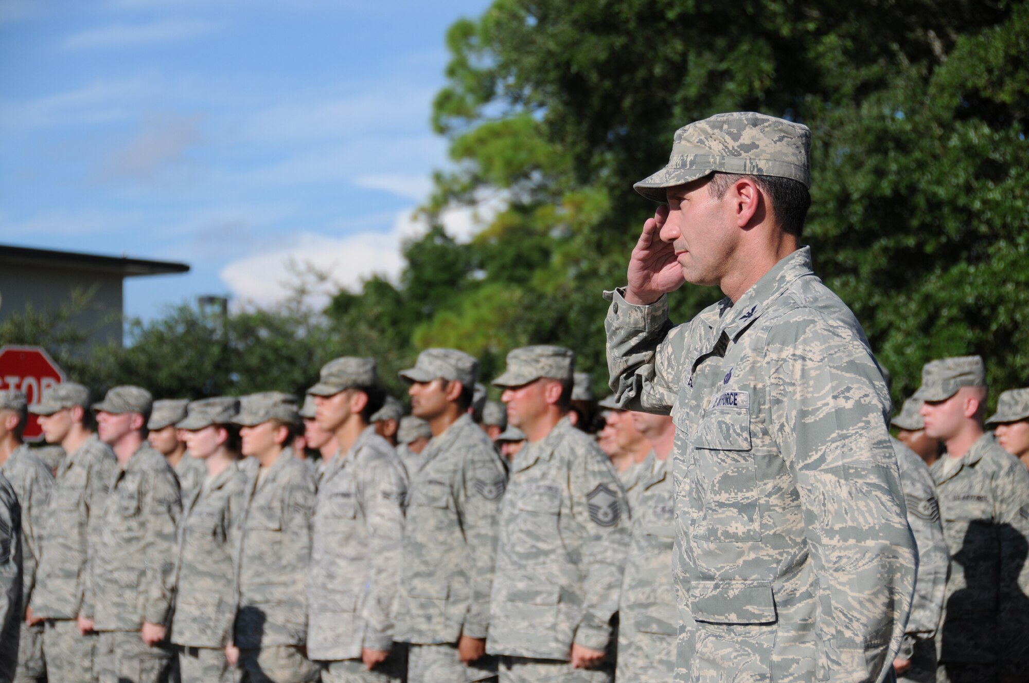 Col. Rodney Berk, 81st Mission Support Group commander, renders a salute during Friday’s formal retreat in front of 81st Training Wing headquarters.  The ceremony commemorated the Sept. 11, 2001, terrorist attacks on the United States and honored all people who have given their lives in defense of America’s freedom.   (U.S. Air Force photo by Kemberly Groue)