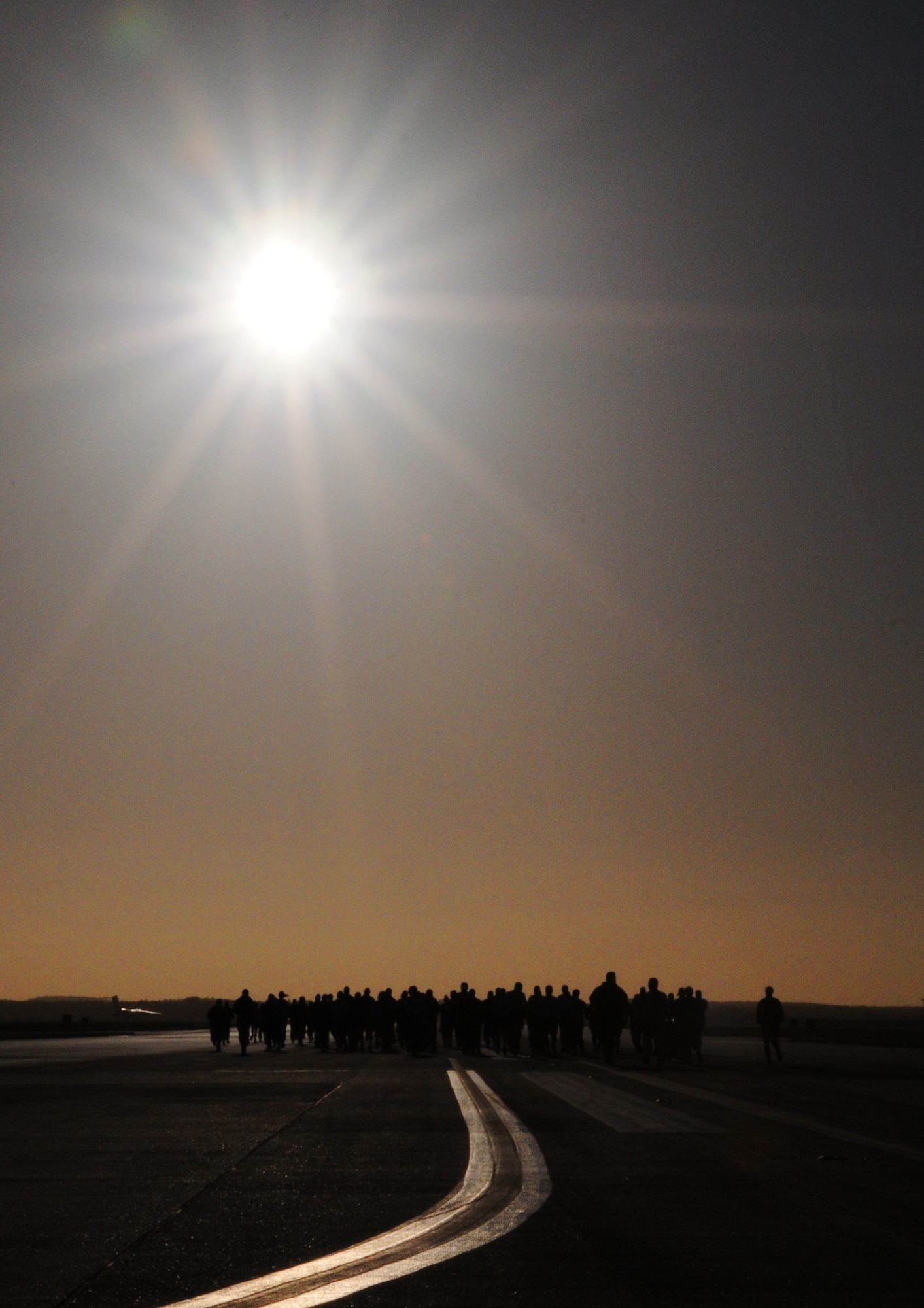 RAF MILDENHALL, England -- About 70 Airmen participate in a 5K race down the runway here Sept. 15 as one of several events scheduled for Prisoner of War/Missing in Action Rembrance Week. Already completed are a breakfast and a motorcycle ride. A 24-hour vigil is scheduled for Sept. 16 at the POW/MIA memorial here and a retreat ceremony will be held Sept. 17 at 4:30 p.m. in front of 100th Air Refueling Wing headquarters. (U.S. Air Force photo/Staff Sgt. Thomas Trower)