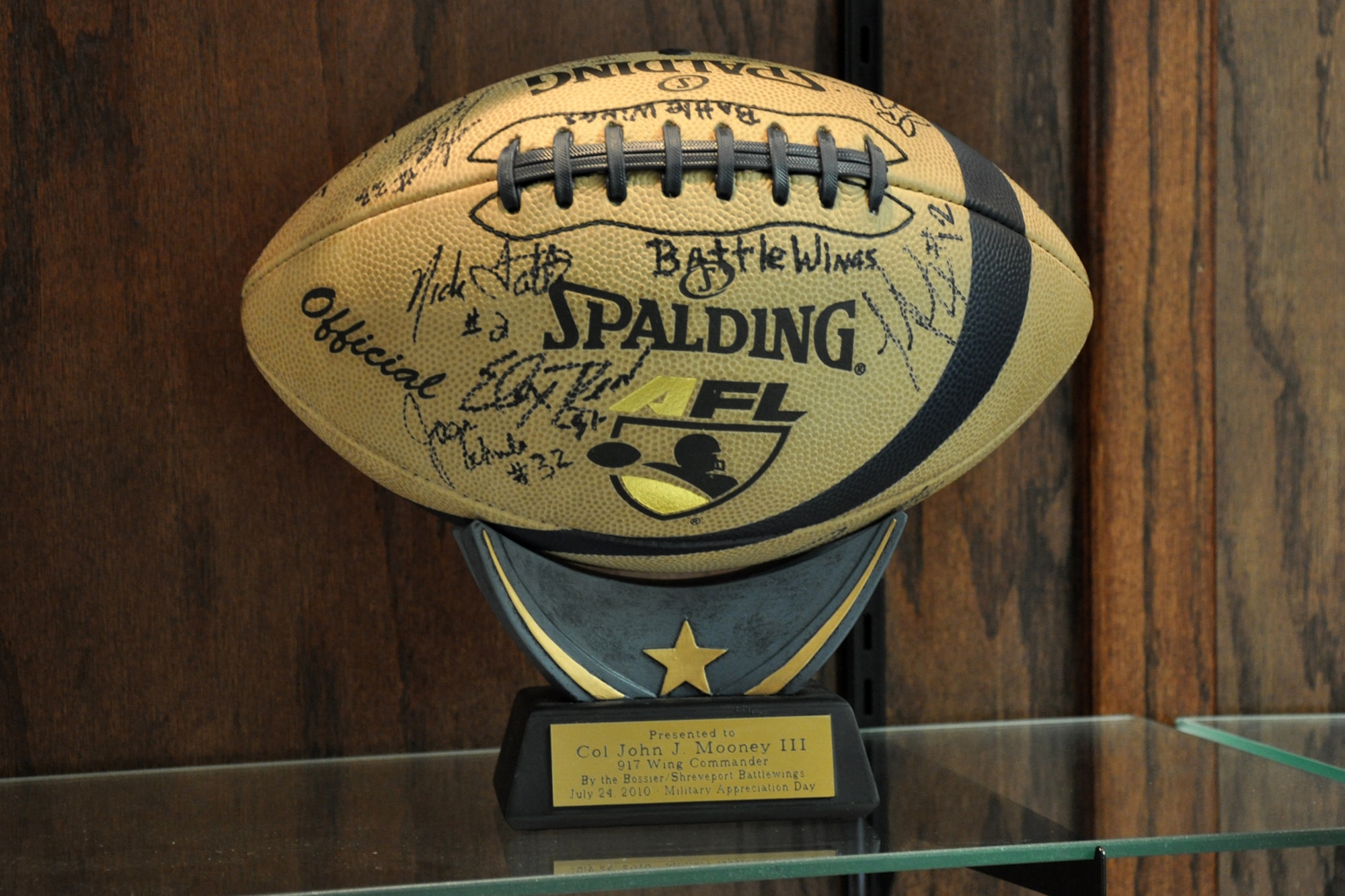 A prized possession sits on a new display stand in the headquarters building
of the 917th Wing at Barksdale Air Force Base, La., Sept. 10, 2010. The
signed football was presented to 917th Wing Commander, Col. John J. Mooney
III, by Sam Newman of the Bossier/Shreveport Battle Wings July 24, on
Military Appreciation Day at the CenturyTel Center during a contest of
endurance between the Battle Wings and Jacksonville Sharks. Col. Timothy
Fay, 2nd Bomb Wing commander, also received a signed football the same day.
(U.S. Air Force photo/Tech. Sgt. Jeff Walston)


