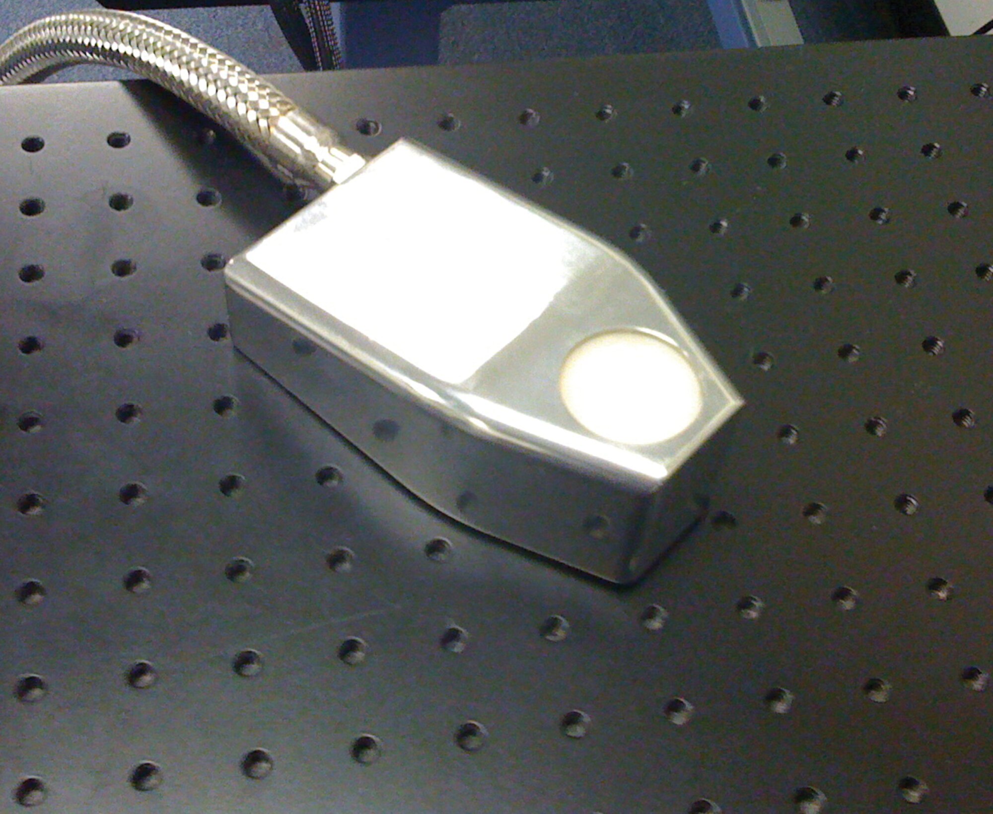 Integrated with existing robotic spray booth technology, this compact collinear transceiver contributes to the first-ever nondestructive capability for sensing/measuring the wet thickness of specialty paint coating materials. (AFRL image)