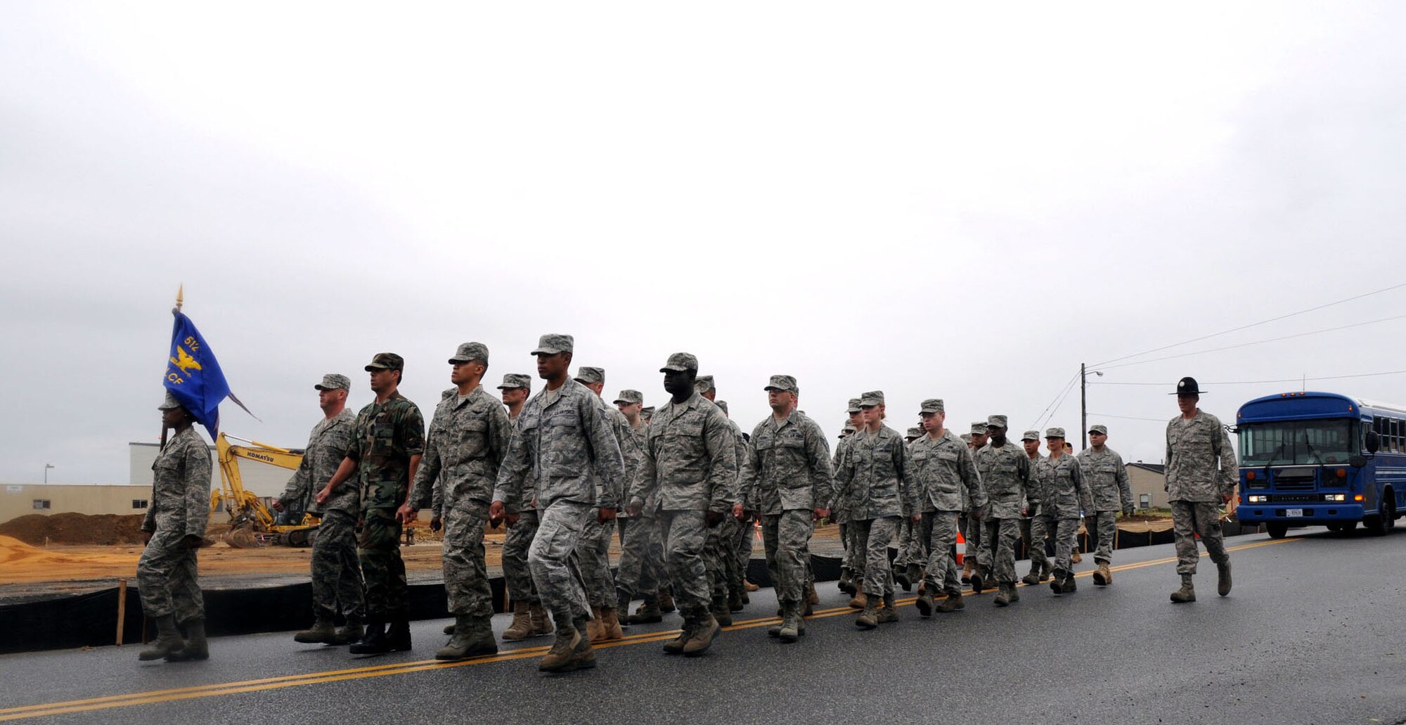 Airmen's Weekend participants, led by former military training instructor Tech. Sgt. Jeffrey Bushaw, 736th Aircraft Maintenance Squadron support staff, march across Dover Air Force Base, Del., Sept. 11, 2010. Three former TIs, who are currently assigned to the 436th Airlift Wing, contributed to the event by taking the attendees though drill techniques and open ranks before marching the flight to lunch. (U.S. Air Force photo by Senior Airman Andria J. Allmond/Released)