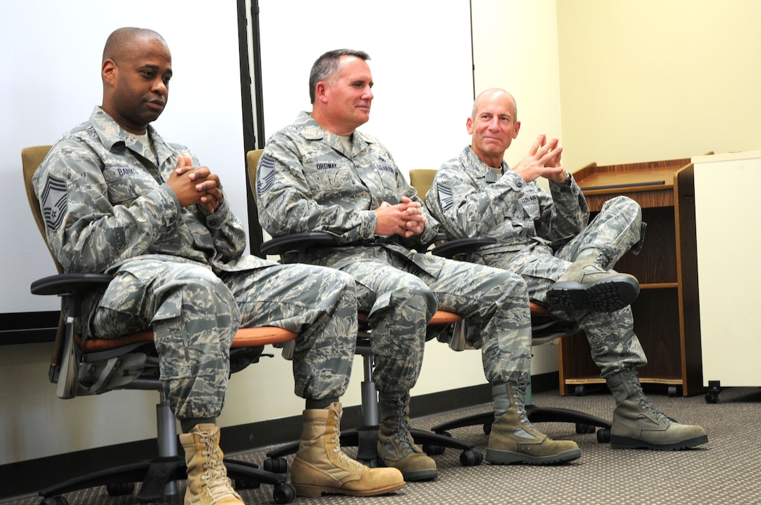 Chief Master Sgts. Mark Banks (left), of the 512th Security Forces Squadron, and  Gregory Ordway (middle) and Christopher Ford, of the 512th Maintenance Group, participate in a chiefs panel during Airmen's Weekend at Dover Air Force Base, Del., Sept. 11, 2010. Representing the Liberty Wing's senior enlisted, the Reserve chiefs answered questions as well as asked questions of those in attendance. Airmen's Weekend, an annual two-day event, aims to create or retain esprit de corps in the enlisted Airmen who attend. (U.S. Air Force photo by Senior Airman Andria J. Allmond/released) 