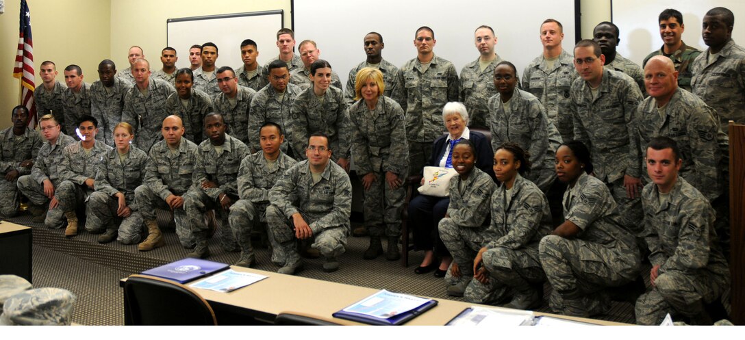 Participants of the 2010 Airmen's Weekend pose with Women Airforce Service Pilot Elaine Danforth Harmon at Dover Air Force Base, Del., Sept. 11, 2010. Mrs. Harmon recounted her days as one of the first female pilots in the U.S. military for the all-reservist audience. Airmen's Weekend is an annual 512th Airlift Wing event and is aimed at perpetuating pride and esprit de corps in the attending Airmen. (U.S. Air Force photo by Senior Airman Andria J. Allmond/released)