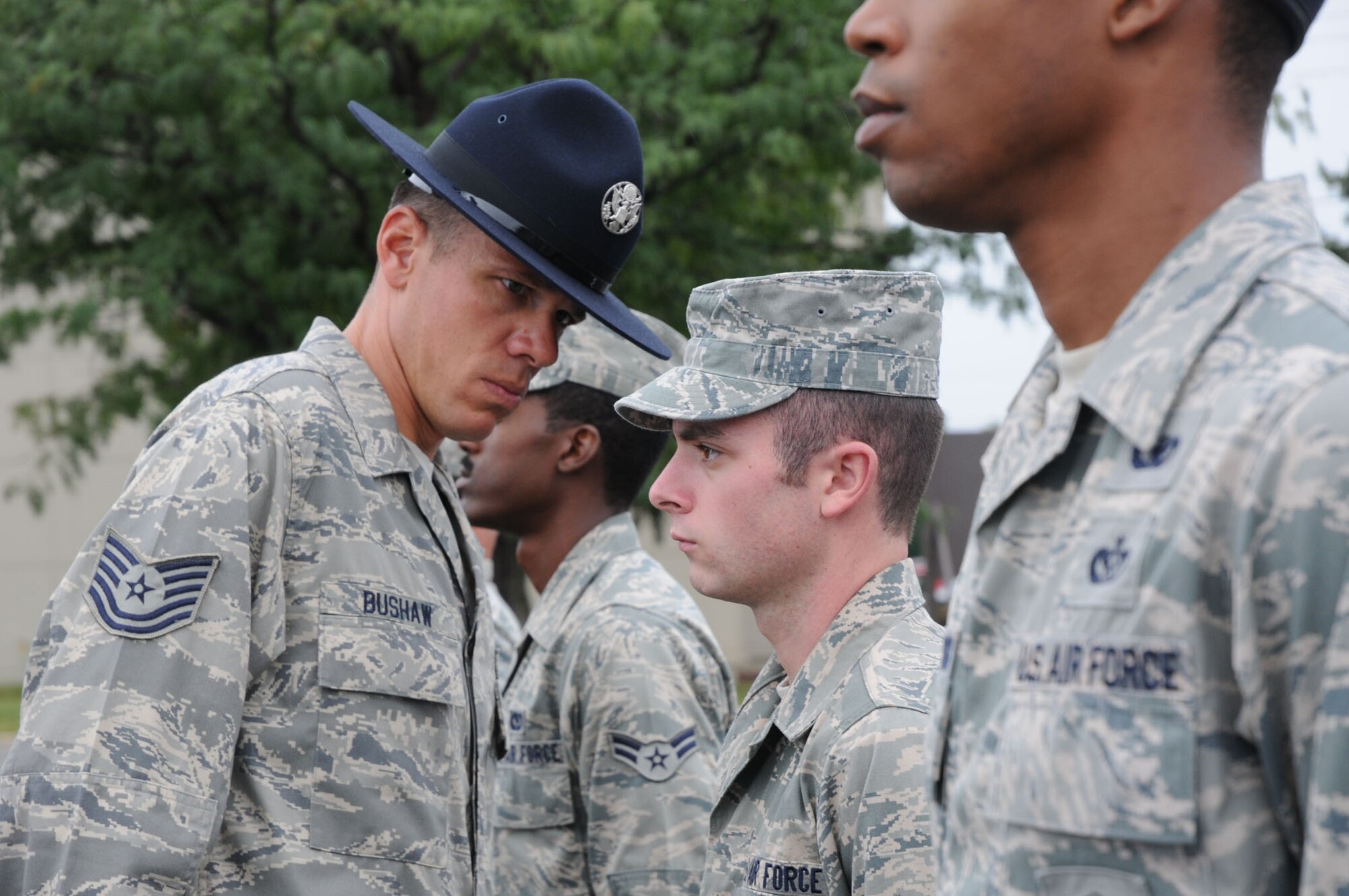 Former military training instructor Tech. Sgt. Jeffrey Bushaw, 736th Aircraft Maintenance Squadron support section, inspects the uniforms and appearances of Airmen's Weekend participants at Dover Air Force Base, Del., Sept. 11, 2010. Sergeant Bushaw and two other former TIs attended the event and reviewed drill techniques and open ranks before marching the participants across base. (U.S. Air Force photo by Senior Airman Andria J. Allmond/Released)