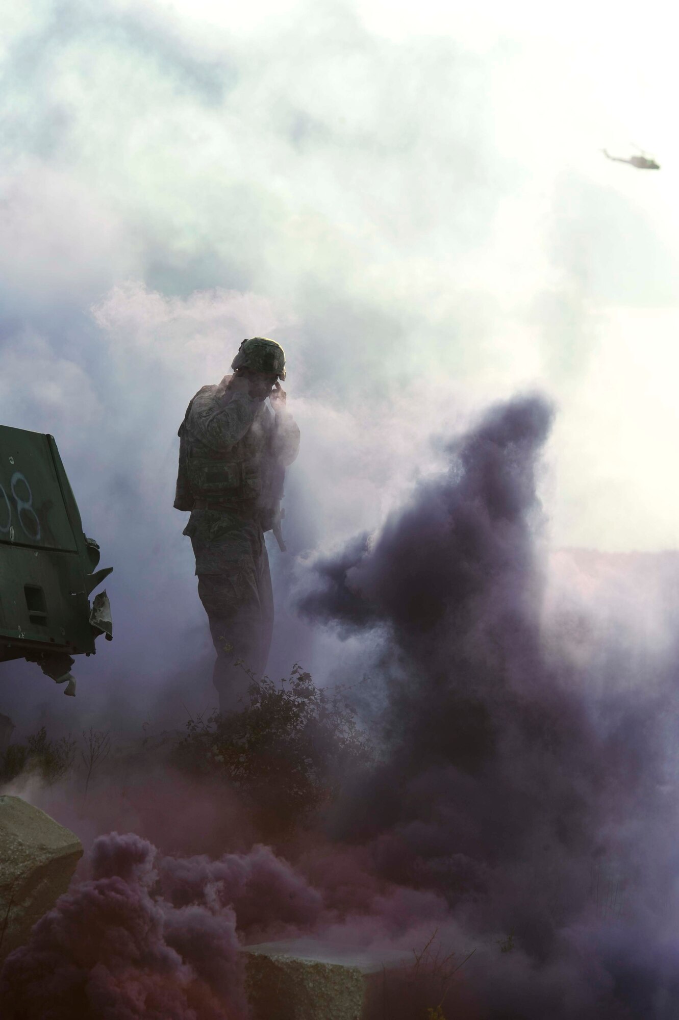 AVON PARK, Fla. -- Air Force Staff Sgt. Michaelson, south tactical lane team leader, pops smoke at Atlantic Strike 10-02, Sept. 14, 2010.  Popping smoke is one of the ways the team leads get the joint terminal attack controller and joint fires observer to have a sense of urgency. STAC is one of four different lanes that Atlantic Strike is set up for. Atlantic Strike is a biannual Air Combat Command sponsored joint training exercise designed for the tactical employment of air power in support of joint terminal attack controller and joint fires observer integration through close air support. (Air Force photo/Staff Sgt. Patrick Mitchell)
