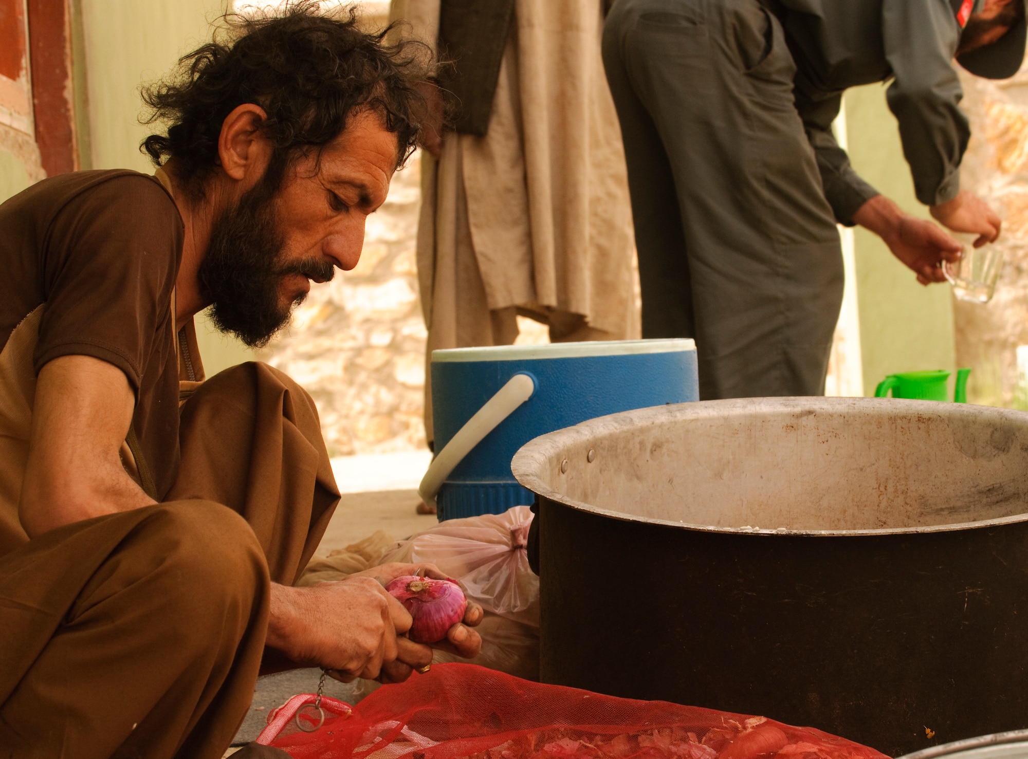 FORWARD OPERATING BASE BULLARD, Afghanistan - An Afghan cook prepares a meal for elders during an election shura at the Shah Joy District Center, Shah Joy District, Zabul province, Sept. 13. Shah Joy District Chief Abdul Qayum invited local elders to the district center to discuss the upcoming provincial parliamentary elections and to celebrate the end of Ramadan. (U.S. Air Force Photo/Senior Airman Nathanael Callon/Released)