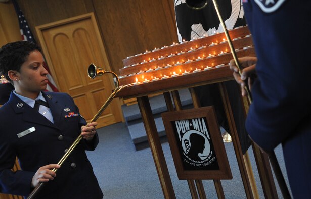 Airman 1st Class Britney Nolley, 51st Logistics Readiness Squadron, lights a candle at the POW/MIA candlelight vigil at the Osan Air Base Chapel Sept. 13. National POW/MIA Recognition Day is annually observed in the United States on the third Friday of September. The base will hold observances and ceremonies for the entire week leading up to the national observance. (U.S. Air Force photo/Senior Airman Evelyn Chavez)