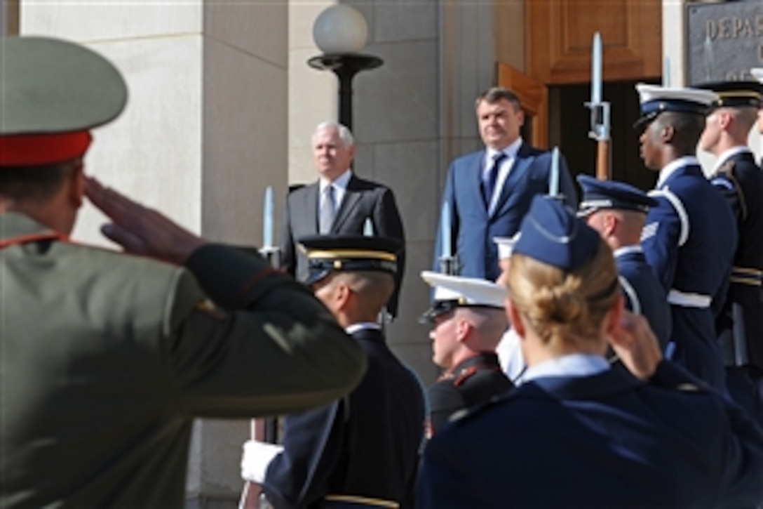 Secretary of Defense Robert M. Gates, left at top of stairs, hosts an armed forces full honor arrival ceremony at the Pentagon for visiting Russian Minister of Defense Anatoly Serdykov, right.  The two defense leaders will hold meetings throughout the day on a variety of bilateral security issues.