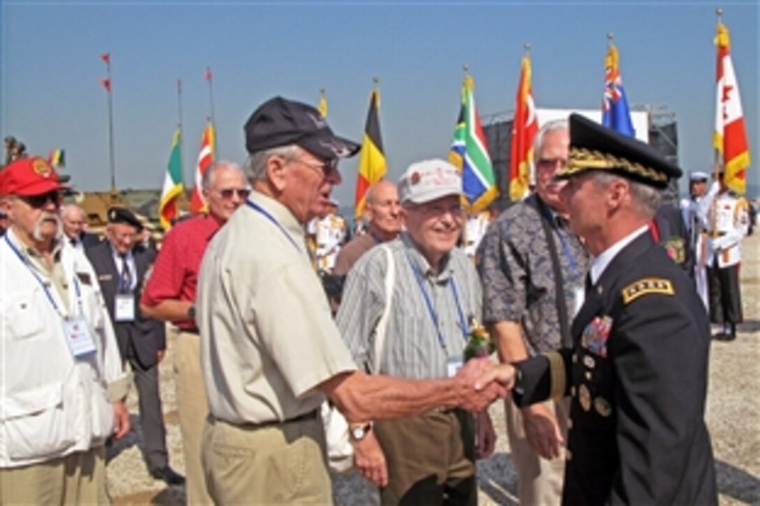 Army Gen. Walter Sharp, right, commander of United Nations Command, Combined Forces Command and U.S. Forces Korea, thanks Korean War veterans for their service and sacrifices during ceremonies marking the 60th anniversary of the Inchon Landing in South Korea, Sept. 15. 2010.