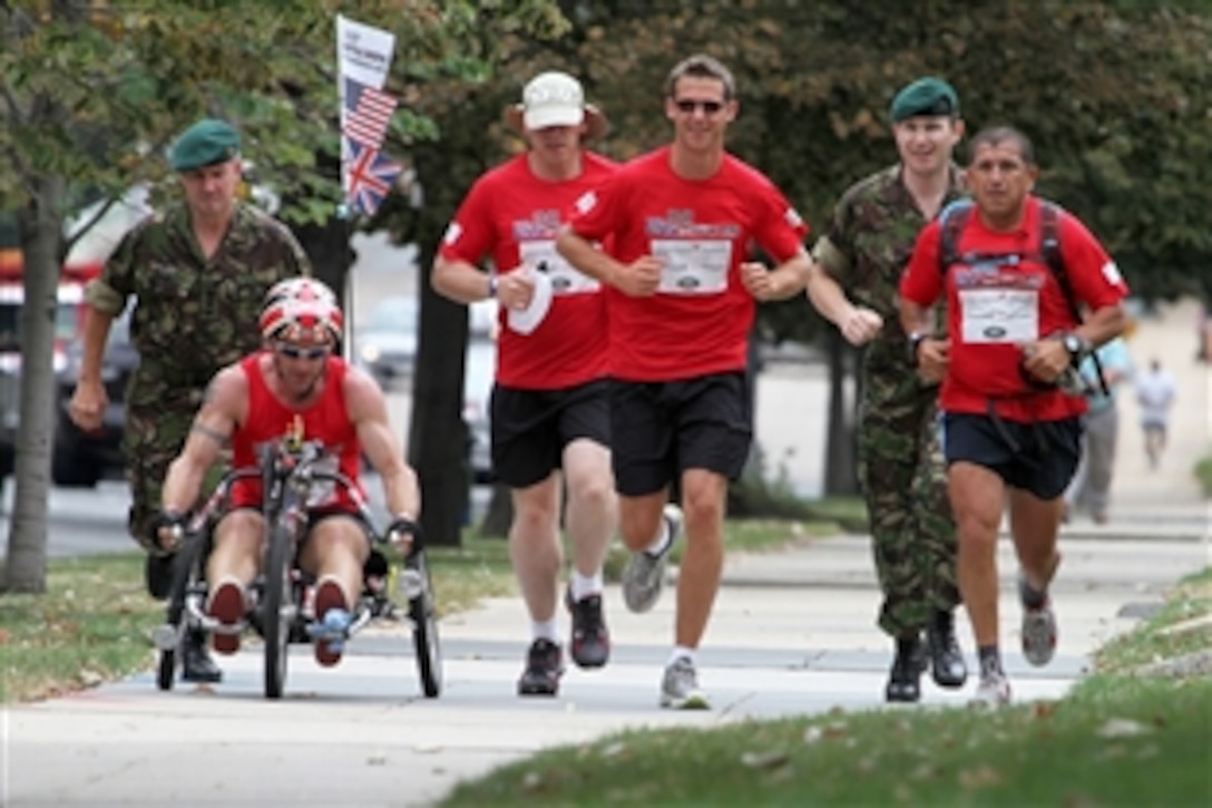 U.S. Marine and British Royal Marine Commandos run and wheel through Washington, D.C., during the "Gumpathon" fundraising event, Sept. 14, 2010. The Gumpathon aims to raise $1.5 million for charities supporting the well-being of American and British wounded warriors.