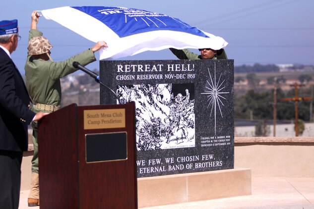 A monument in dedication to those who risked their lives at the Chosin Reservoir is unveiled at the Camp Pendleton South Mesa Club, Sept. 15. The ceremony was held in honor of the 60th anniversary of Operation Chromite; the dangerous and difficult amphibious landing at Inchon, Korea, Sept. 15, 1950. The 3,000 pound granite monument is a tribute to the more than 4,400 Marines and soldiers who did not survive overwhelming odds and the 35 degrees below zero weather battle.