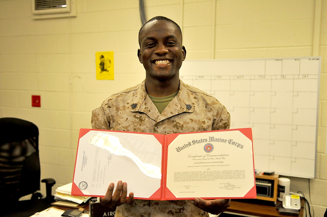 Sgt. Sheriff Showunmi, Marine Attack Squadron 214 maintenance administration clerk, displays his noncommissioned officer of the quarter award from the 3rd Marine Aircraft Wing. Showunmi earned the NCO of the quarter title for the 3rd MAW and the 1st Marine Expeditionary Force.