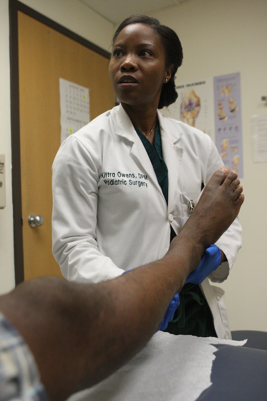 Navy Lt. Kittra Owens, podiatry department head for Naval Hospital Camp Lejeune, examines a lower leg injury, Sept. 16. Owens is one of two NHCL podiatrists and sees approximately 80 patients a week and performs about 30 surgeries a month.