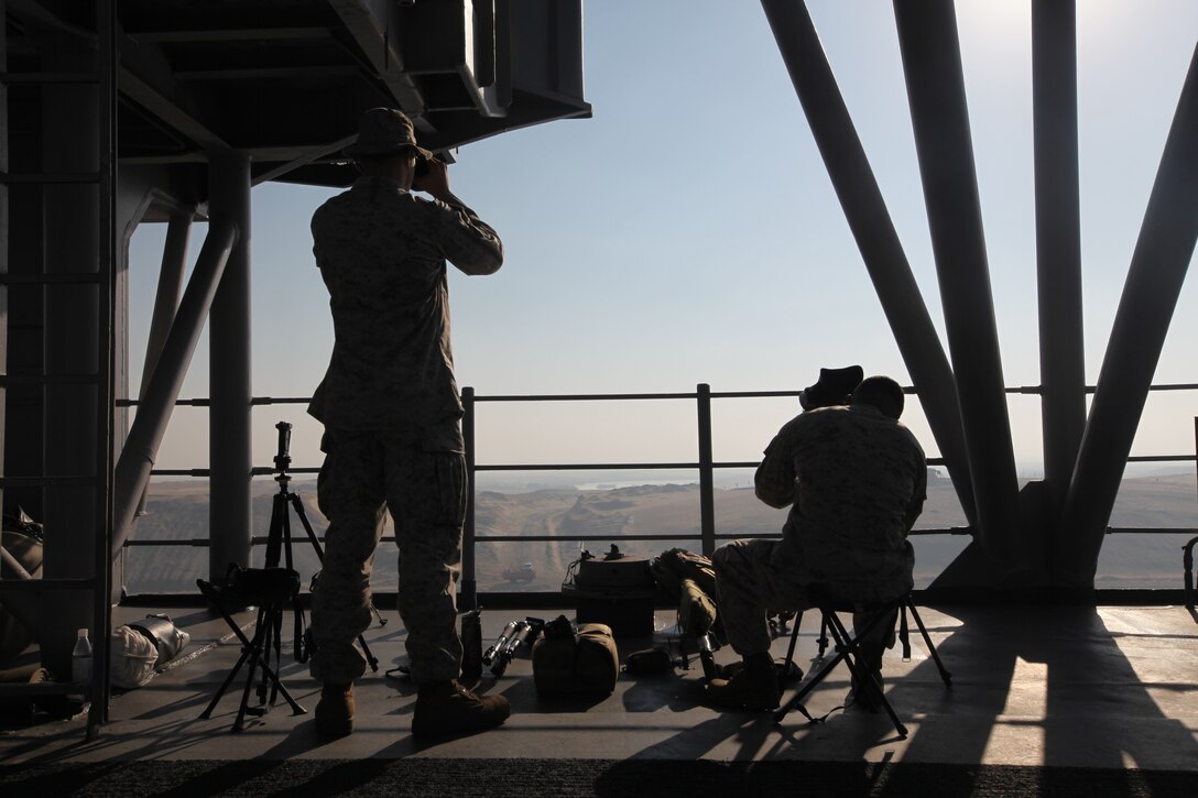 Scout snipers with Scout Sniper Platoon, Battalion Landing Team 3/8, 26th Marine Expeditionary Unit, provide overwatch while USS Kearsarge transits the Suez Canal, Sept. 16, 2010. 26th MEU deployed aboard the ships of Kearsarge Amphibious Ready Group in late August responding to an order by the Secretary of Defense to support Pakistan flood relief efforts.