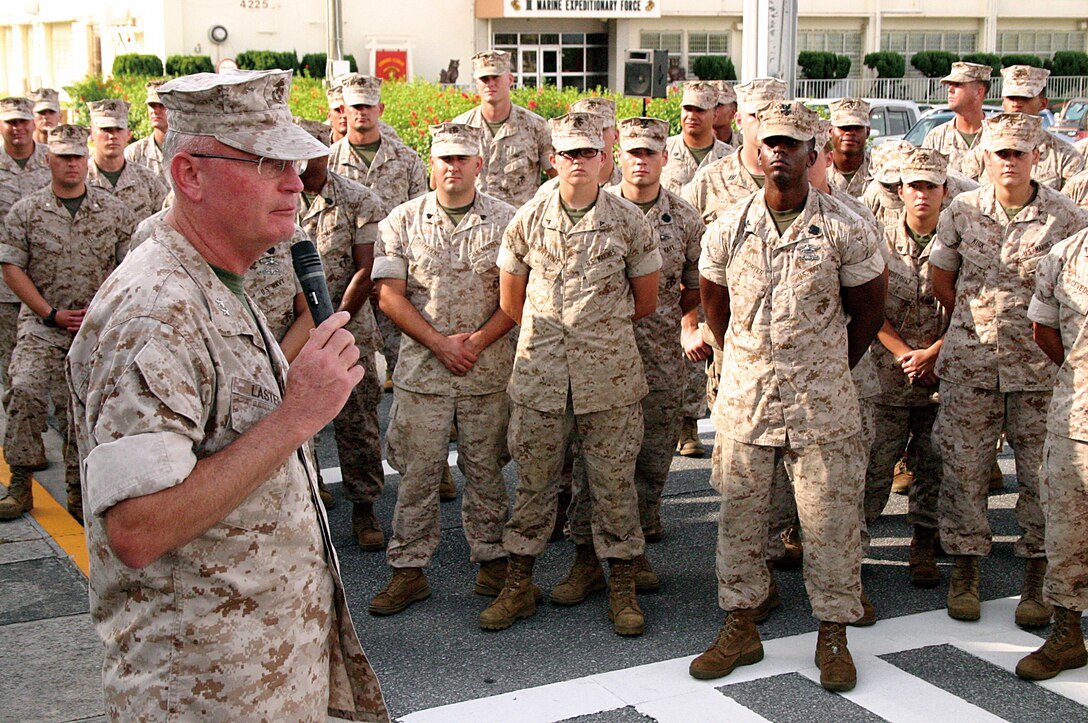 Maj. Gen. James B. Laster, 3rd Marine Division commanding general, speaks to his Marines in a school circle outside the division’s headquarters on Camp Courtney following a ceremony commemorating the division’s 68th birthday Sept. 16. Laster asked the Marines to take a few moments that afternoon to reflect on the unit’s proud history and then spend time with family and friends.
