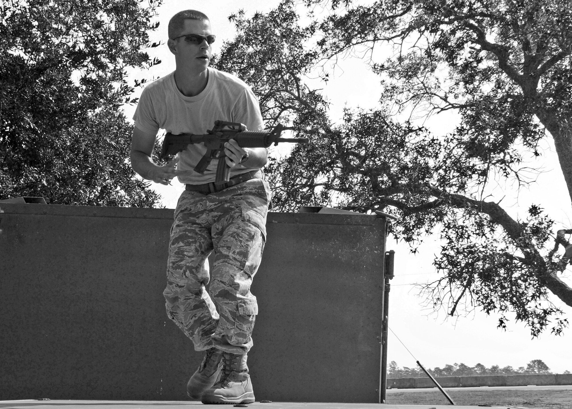Staff Sgt. Josiah Wood, 919th Security Forces Squadron, surveys the scene during a bound and overwatch training procedure Sept. 12 during the UTA weekend. (U.S. Air Force photo/Samuel King Jr.) 