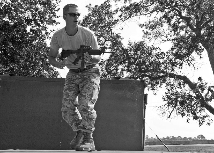 Staff Sgt. Josiah Wood, 919th Security Forces Squadron, surveys the scene during a bound and overwatch training procedure Sept. 12 during the UTA weekend. (U.S. Air Force photo/Samuel King Jr.) 