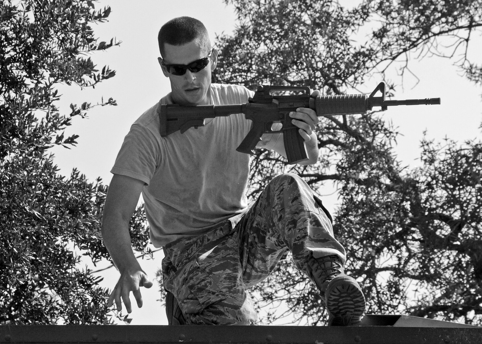 Staff Sgt. Josiah Wood, 919th Security Forces Squadron, leaps to the next obstacle during a bound and overwatch training procedure Sept. 12 during the UTA weekend. (U.S. Air Force photo/Samuel King Jr.)