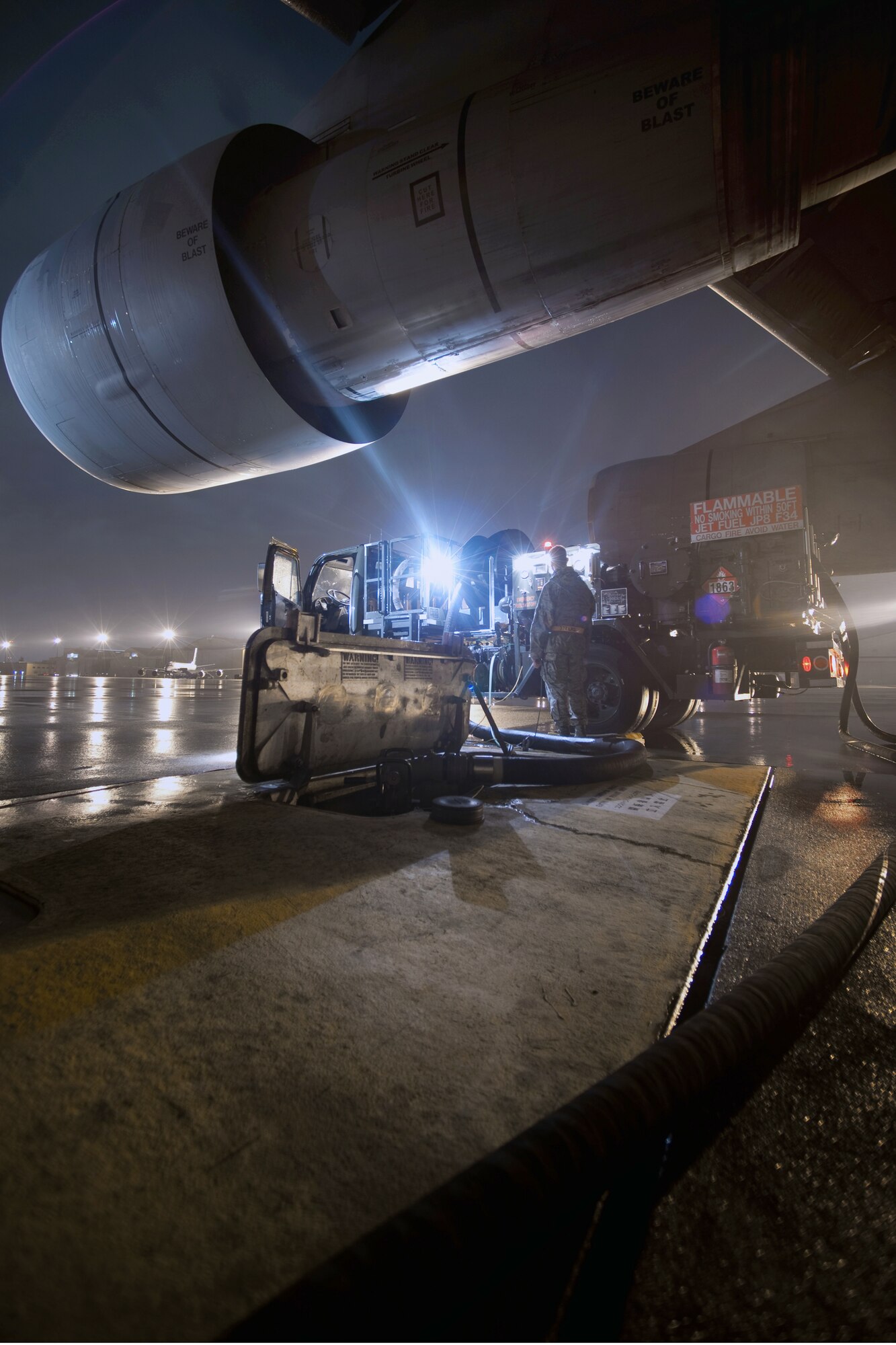 YOKOTA AIR BASE, Japan -- Members from the 374th Logistics Readiness Squadron refuel a C-5 Galaxy aircraft here Sept. 15. As the airlift hub of the western Pacific, Yokota Airmen work 24/7 operations to keep inbound and outbound aircraft running.  (U.S. Air Force photo/Osakabe Yasuo)