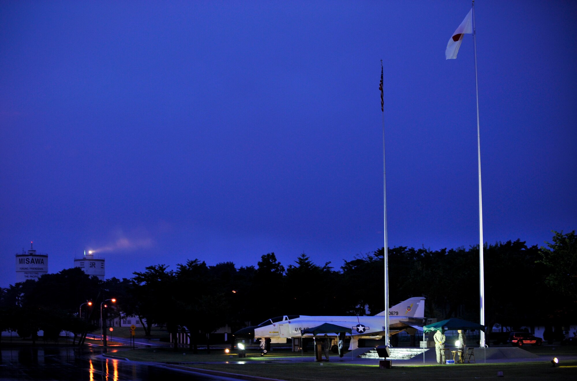 U.S. Air Force Airmen stand announcing names during the POW/MIA vigil ceremony Sept. 17, 2010, at Misawa Air Base, Japan. This is Misawa AB's first-ever vigil. (U.S. Air Force photo/Staff Sgt. Chad C. Strohmeyer/Released) 
