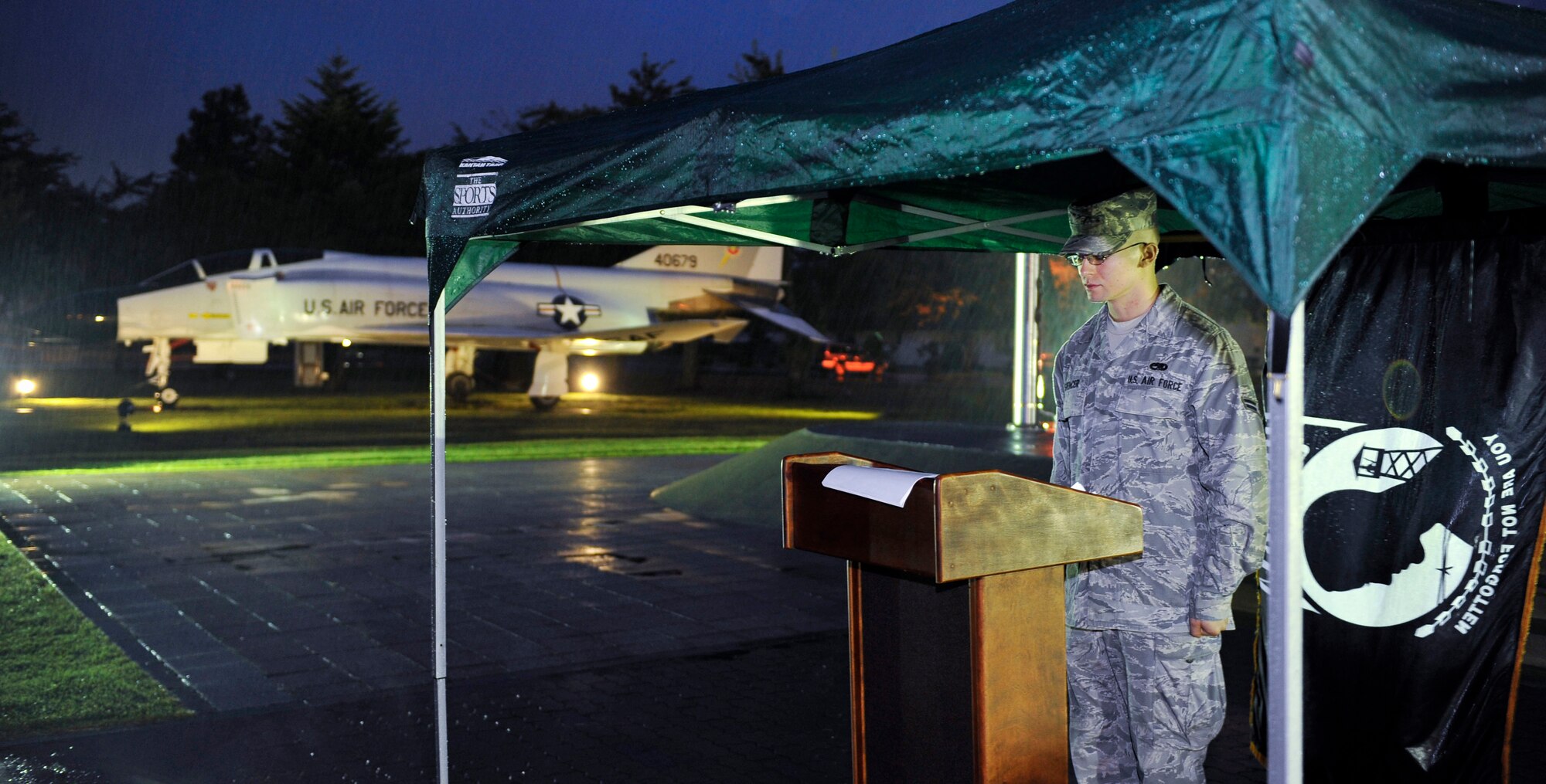 U.S. Air Force Airman 1st Class Sean Spencer, 610th Air Control Flight weapons director technician, stands announcing names during the POW/MIA vigil ceremony Sept. 17, 2010, at Misawa Air Base, Japan. Airman Spencer stood for 15 minutes announcing names of POW/MIA from the Korean and Vietnam wars. (U.S. Air Force photo/Staff Sgt. Chad C. Strohmeyer/Released) 

