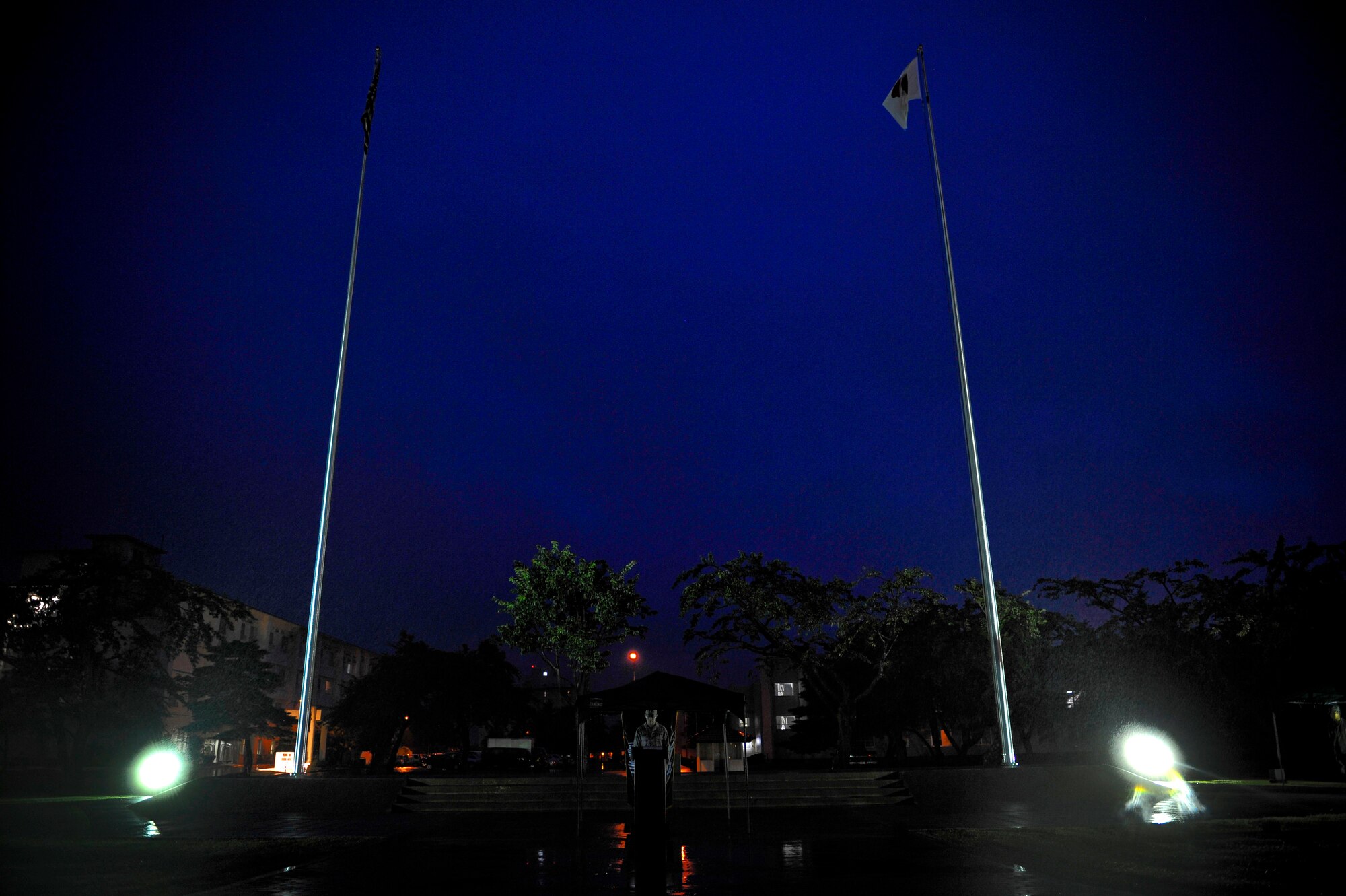 U.S. Air Force Airman 1st Class Sean Spencer, 610th Air Control Flight, stands announcing names during the POW/MIA vigil event Sept. 17, 2010, at Misawa Air Base, Japan. More than 100 Airmen and Sailors stood for 15 minutes at a time honoring the POW/MIA. (U.S. Air Force photo/Staff Sgt. Chad C. Strohmeyer/Released) 
