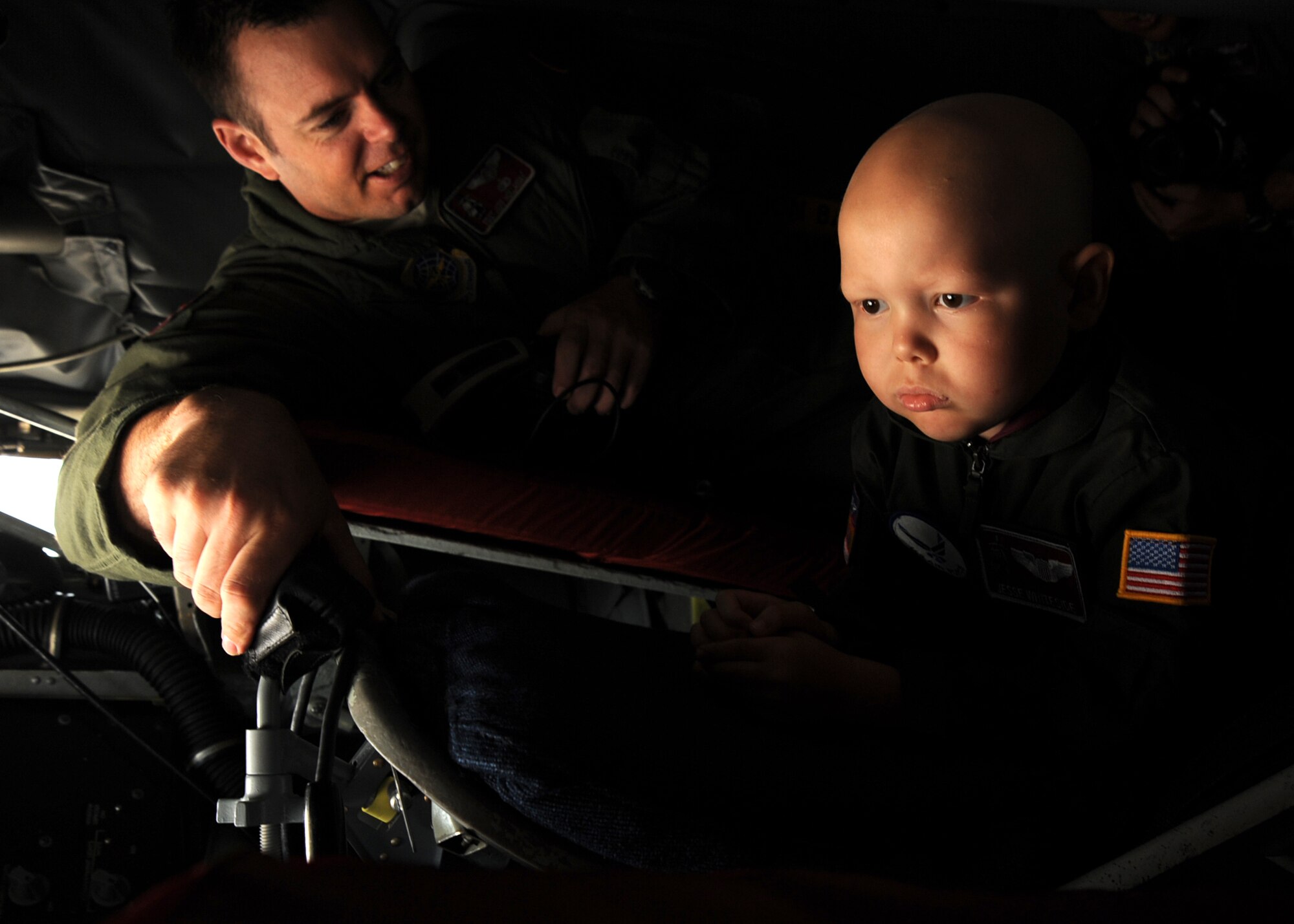 Tech. Sgt. Jeff Hollaway, 384th Air Refueling Squadron operations superintendant, shows 5-year-old Jesse Whiteside, “Pilot For a Day” participant, boom operator controls on a KC-135 Stratotanker, McConnell Air Force Base, Kan., Sept. 16, 2010.  Jesse, who was recently diagnosed with Acute Lymphoblastic Lymphoma, was invited to the base by members of the 384th ARS as part of the Pilot For a Day program, an Air Force program that allows medically-challenged youth a chance to visit a base and tour facilities and aircraft.  (U.S. Air Force photo/Staff Sgt. Dallas Edwards)