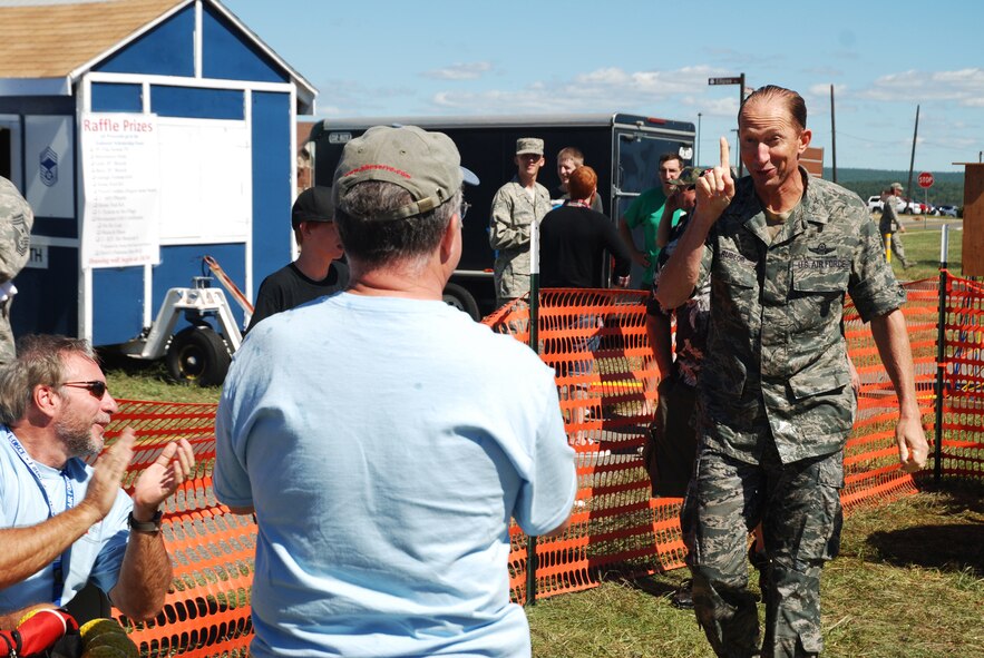 Maj. Gen. James T. Rubeor, 22nd Air Force commander, emerges from the dunk tank at Westover Air Reserve Base's 2010 Family Day.  The two-star general took the first rotation of the dunk tank and was knocked in numerous times.