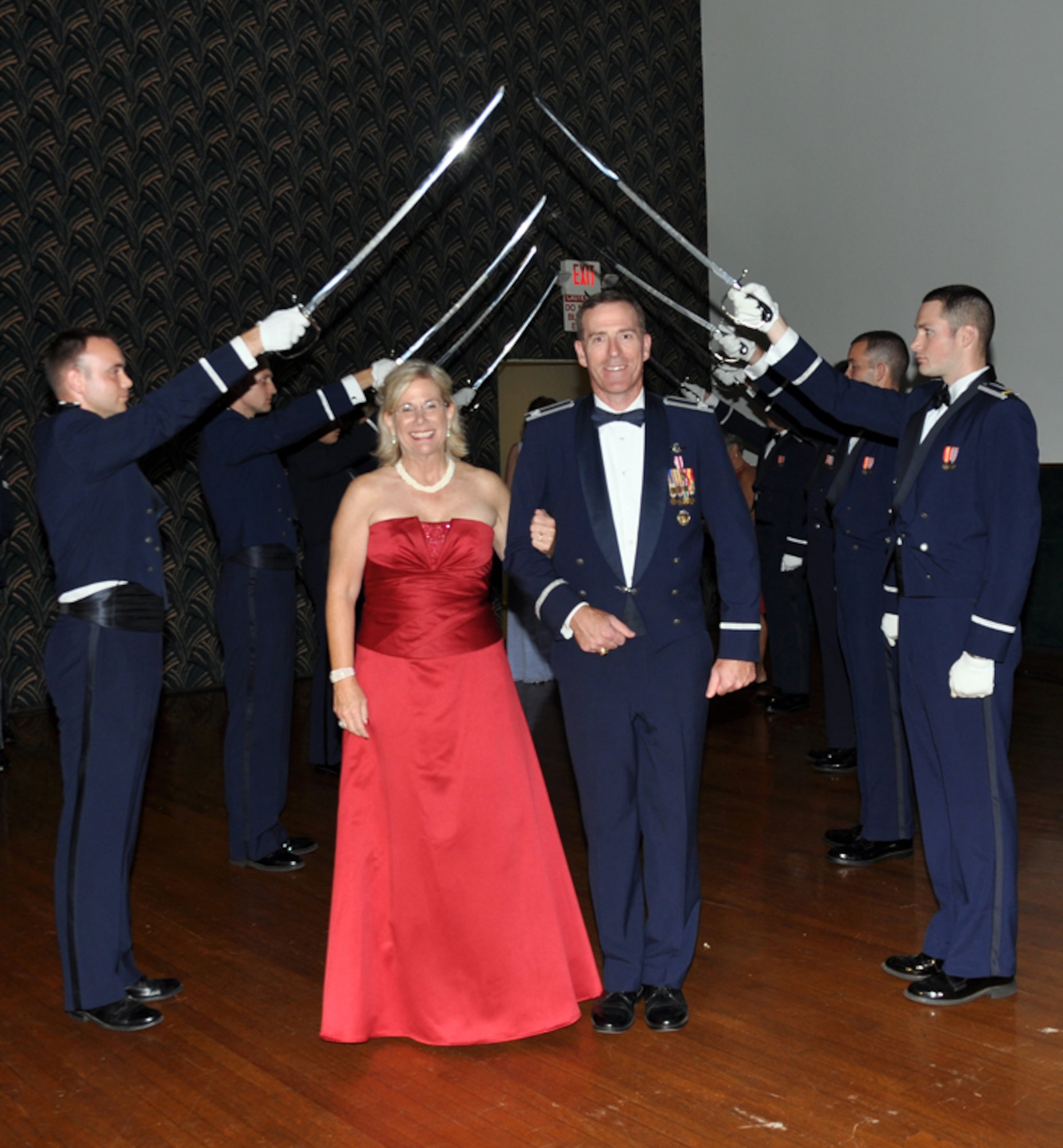 Col. George Ross, 14th Flying Training Wing vice commander and wife Marti, pass through the ceremonial saber arch way upon entering the Air Force Birthday Ball Sept. 10 at the Trotter Convention Center in downtown Columbus, Miss. Columbus AFB celebrated the Air Force’s 63rd Birthday with the theme “Blazing through the Decades” highlighting the base’s active role in the nation’s defense for over 68 years. (U.S. Air Force photo/Staff Sgt. Jacob Corbin).