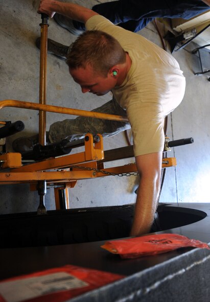 BARKSDALE AIR FORCE BASE, La. -- Staff Sgt. Michael Vowell, 2nd Logistics Readiness Squadron vehicle maintenance mechanic, puts a wheel back on a vehicle Sept. 14. TheLRS provides a variety of support across the base. Vehicle support consists of aircrew buses and a U-Drive-It fleet as well as the maintenance of a $46 million vehicle fleet. (U.S. Air Force photo/Senior Airman Brittany Y. Bateman)(RELEASED)