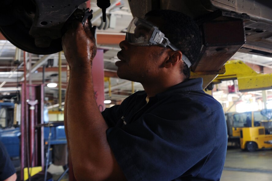 BARKSDALE AIR FORCE BASE, La. -- Airman 1st Class Dwayne Williamson, 2nd Logistics Readiness Squadron vehicle maintenance mechanic, removes bolts from a steering rack and pinion on a vehicle Sept. 14. The LRS provides for movement of personnel and their household goods as well as shipment of all cargo. They are responsible for all Barksdale deployment functions including cargo, mobility and ready-team training. (U.S. Air Force photo/Senior Airman Brittany Y. Bateman)(RELEASED)