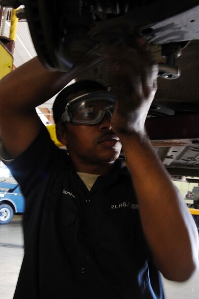 BARKSDALE AIR FORCE BASE, La. --Airman 1st Class Dwayne Williamson, 2nd Logistics Readiness Squadron vehicle maintenance mechanic, removes bolts from a steering rack and pinion on a vehicle Sept. 14. The LRS provides for movement of personnel and their household goods as well as shipment of all cargo. They are responsible for all Barksdale deployment functions, including cargo, mobility and ready-team training. (U.S. Air Force photo/Senior Airman Brittany Y. Bateman)(RELEASED)