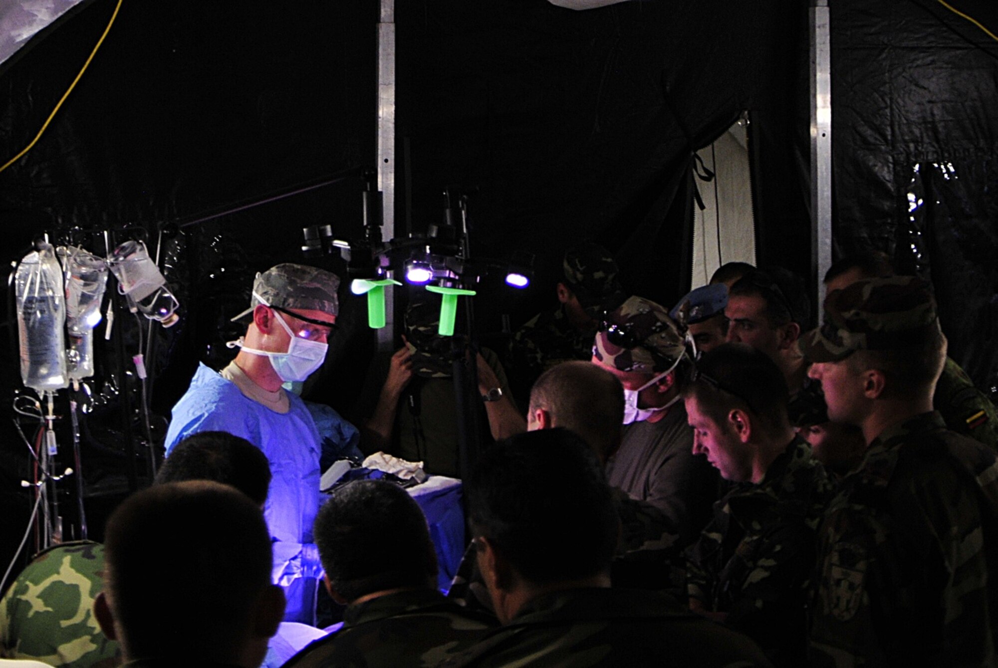 Medical armed forces members from ten nations train together and learn from one another during a mock surgery for a victim of a simulated gas station explosion during MEDCEUR 10, a medical training exercise in central and eastern Europe, at Danilovgrad Army Base, Montenegro, Sept. 15. The exercise is designed to help the servicemembers from all nations to be better prepared for real world situations. For more information, visit www.usafe.af.mil/medceur.asp and www.odbrana.gov.me. (U.S. Air Force photo/Airman 1st Class Tiffany Deuel)