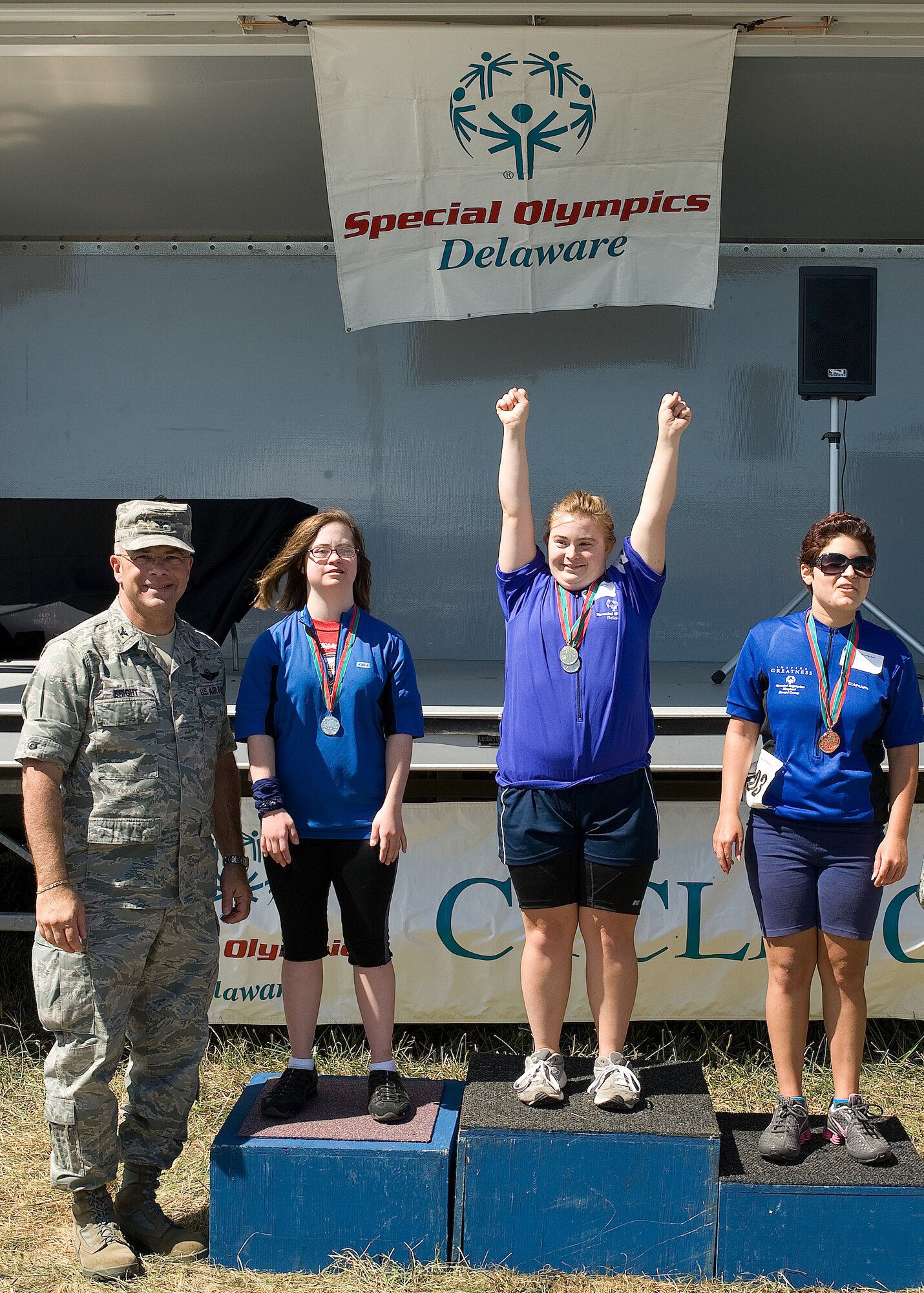 Col. Randal L. Bright, 512th Airlift Wing commander, presented medals to the first, second and third place winners participating in the Special Olympics Delaware 2010 cycling tournament at Dover Air Force Base, Del., Sept. 11. The races were held from 8 to 11 a.m. and were at distances of 500 meters, one kilometer, five kilometers, 10 kilometers, 15 kilometers, 20 kilometers and a tandem bike event. (U.S. Air Force photo by Jason Minto/Released)