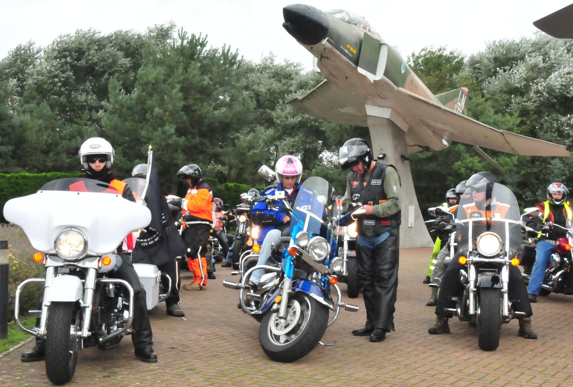 ROYAL AIR FORCE LAKENHEATH, England - A group of motorcyclists prepares to take off in the "Rolling Thunder" memorial ride at RAF Lakenheath on Sept. 14. The ride was in observance of Prisoner of War/Missing in Action remembrance week. Riders laid wreaths at war memorials along the route. (U.S. Air Force photo/Staff Sgt. Connor Estes) 