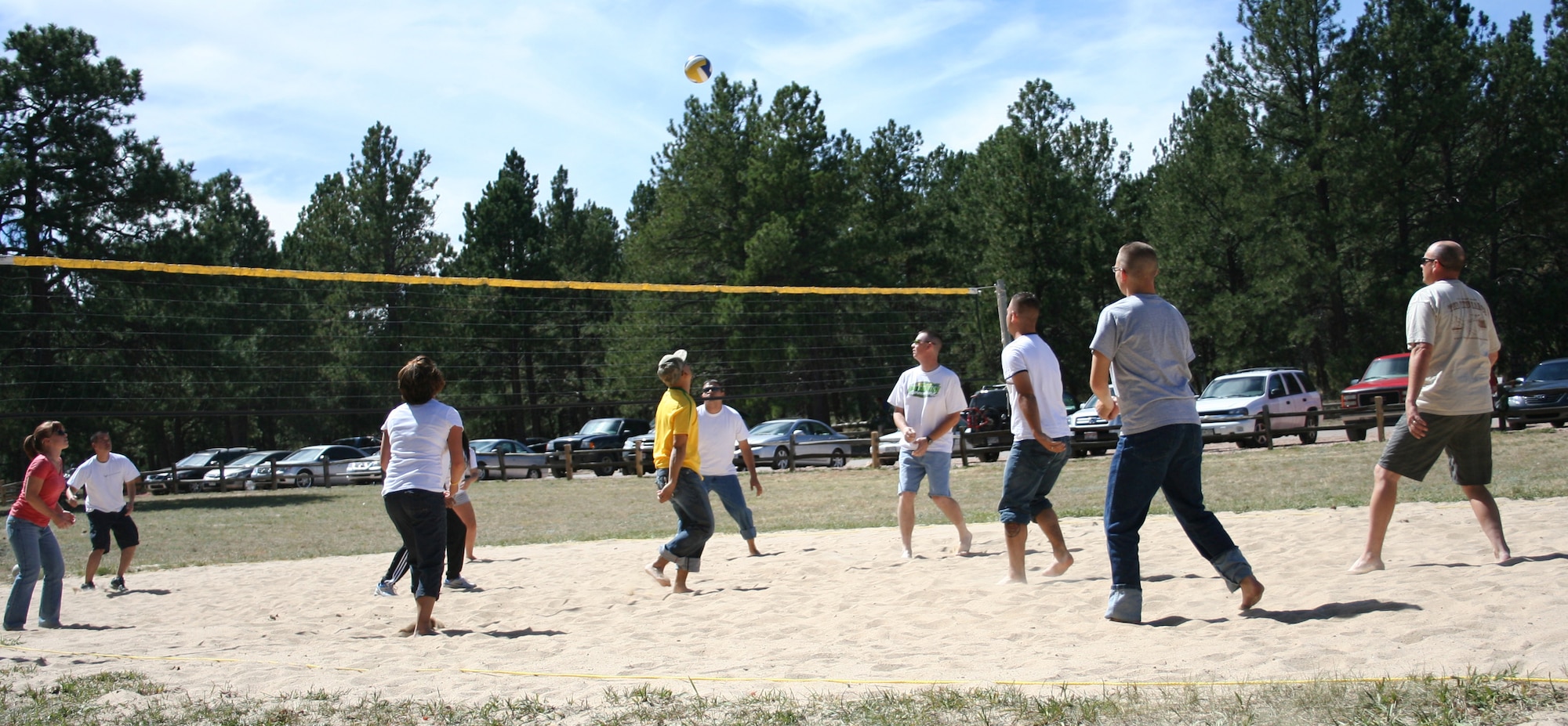 Squadrons from the 310th Space Wing played in a single-round elimination volleyball tournament Sept. 12, at the southern units family day picnic. Airmen and their families also participated in a water balloon toss, egg races and played other games throughout the picnic at the U.S. Air Force Academy?s FamCamp. (U.S. Air Force Photo/ Staff Sgt. Desiree Economides)