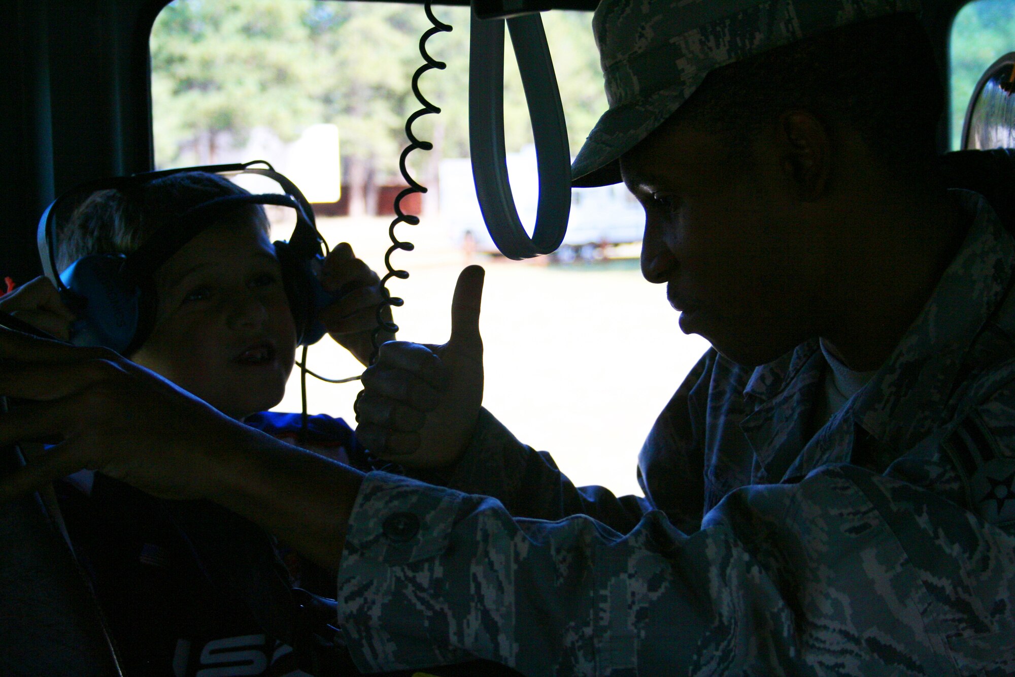 Firefighters from the 10th Air Base Wing showed off their fire engine and equipment Sept. 12 at the 310th Space Wing?s southern units family day picnic held at the Air Force Academy?s FamCamp. Various organizations from the Academy and the 310SW contributed to the success of this year?s picnic. (U.S. Air Force Photo/ Staff Sgt. Desiree Economides) 