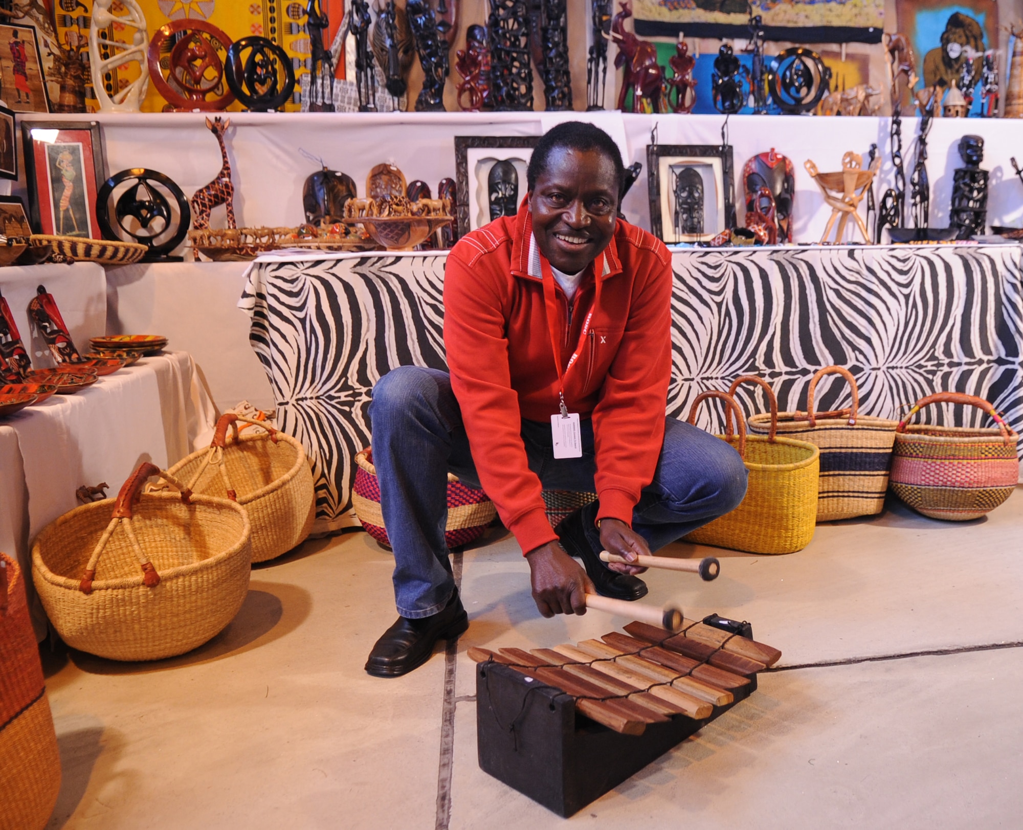 Nicholas Ipewa, The Kenya Shop vendor, plays an African Balaphone at the Ramstein Welfare Bazaar, Ramstein Air Base, Germany, Sept. 16, 2010. For more than four decades, the Kaiserslautern Military Community has benefited from the Ramstein Welfare Bazaar. This annual event dates back to 1965 and has grown into one of the largest military bazaars in Europe. (U.S. Air Force photo by Airman 1st Class Brittany Perry)
