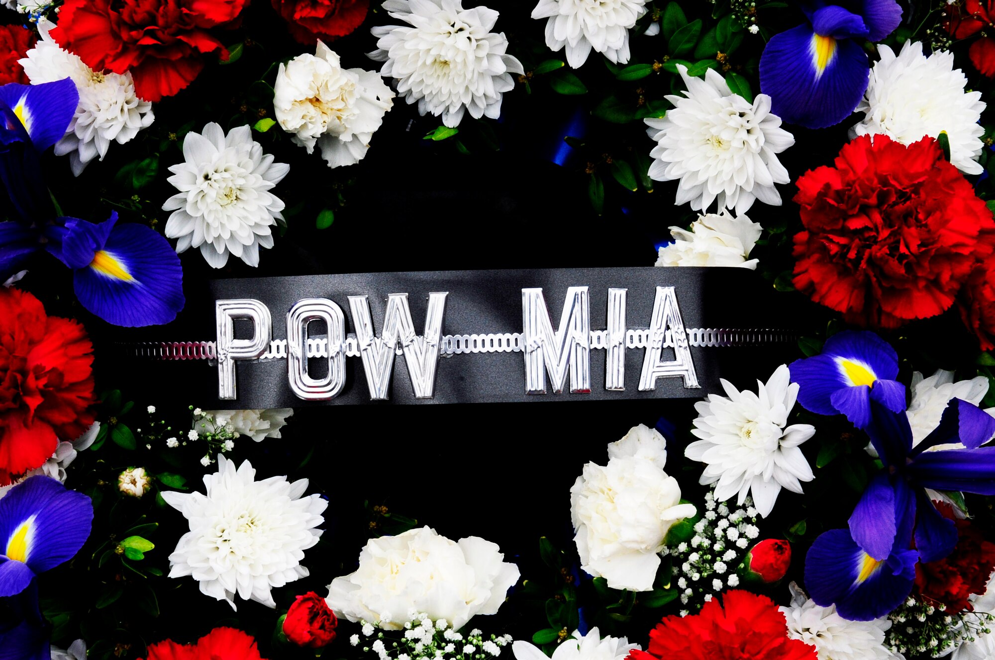 RAF MILDENHALL, England -- The Prisoner of War/Missing in Action wreath, from the Rolling Thunder Motorcycle Rally, sits at the base of the "Lest we Forget" wall at RAF Lakenheath Sept. 14. Wreaths were laid at four different war memorials during the ride. (U.S. Air Force photo/Senior Airman Ethan Morgan)
