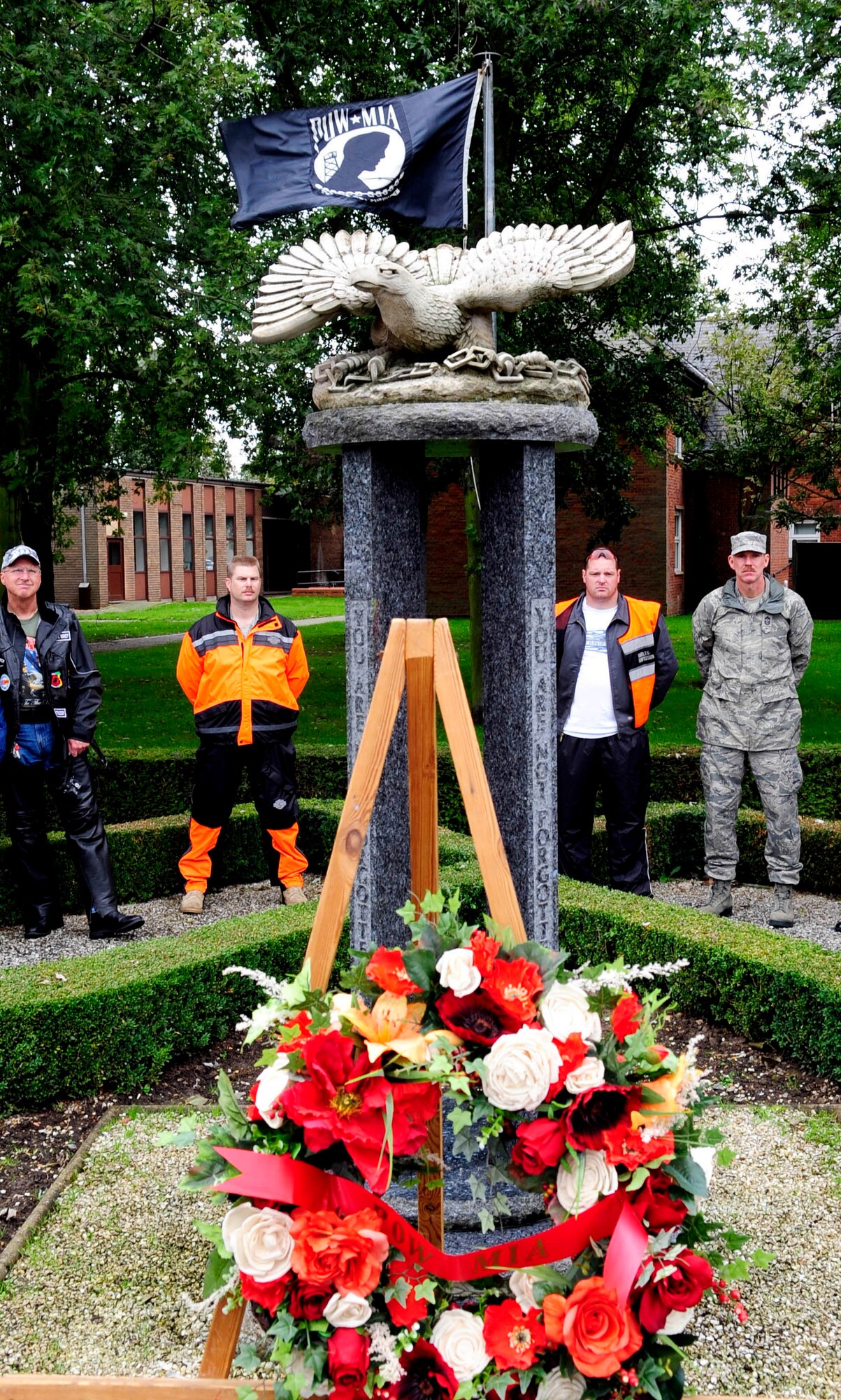 RAF MILDENHALL, England -- Base motorcyclists from RAFs Mildenhall and Lakenheath gather at the RAF Mildenhall Prisoner of War/Missing in Action War Memorial across from 100th Air Refueling Wing headquarters Sept. 14. As part of the joint-base week-long POW/MIA observance, motorcyclists made stops in the town of Mildenhall and Lakenheath village to lay wreaths at war memorials before finishing the ride at RAF Lakenheath's Memorial Park by the 'Lest we Forget' wall. (U.S. Air Force photo/Senior Airman Ethan Morgan)