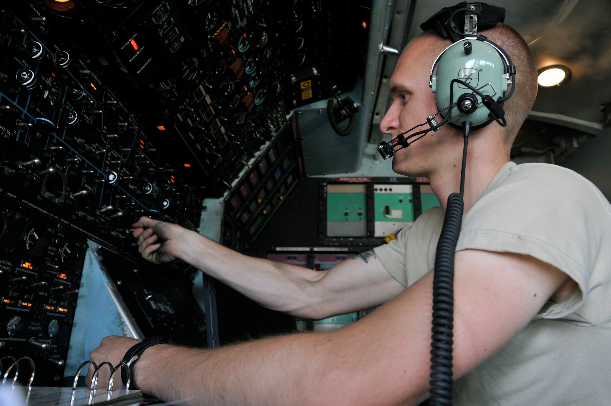 Senior Airman Douglas Osman, 521st Air Mobility Operations Group engine mechanic regulates the flow of fuel through the tanks in the wings of a C-5 Galaxy Sept. 13, 2010, at Al Asad Air Base, Iraq. Airman Osman must balance out the wings fuel within 8,000 lbs of each other to ensure the C-5 flies safely.(U.S. Air Force photo by Senior Airman Perry Aston) (Released)