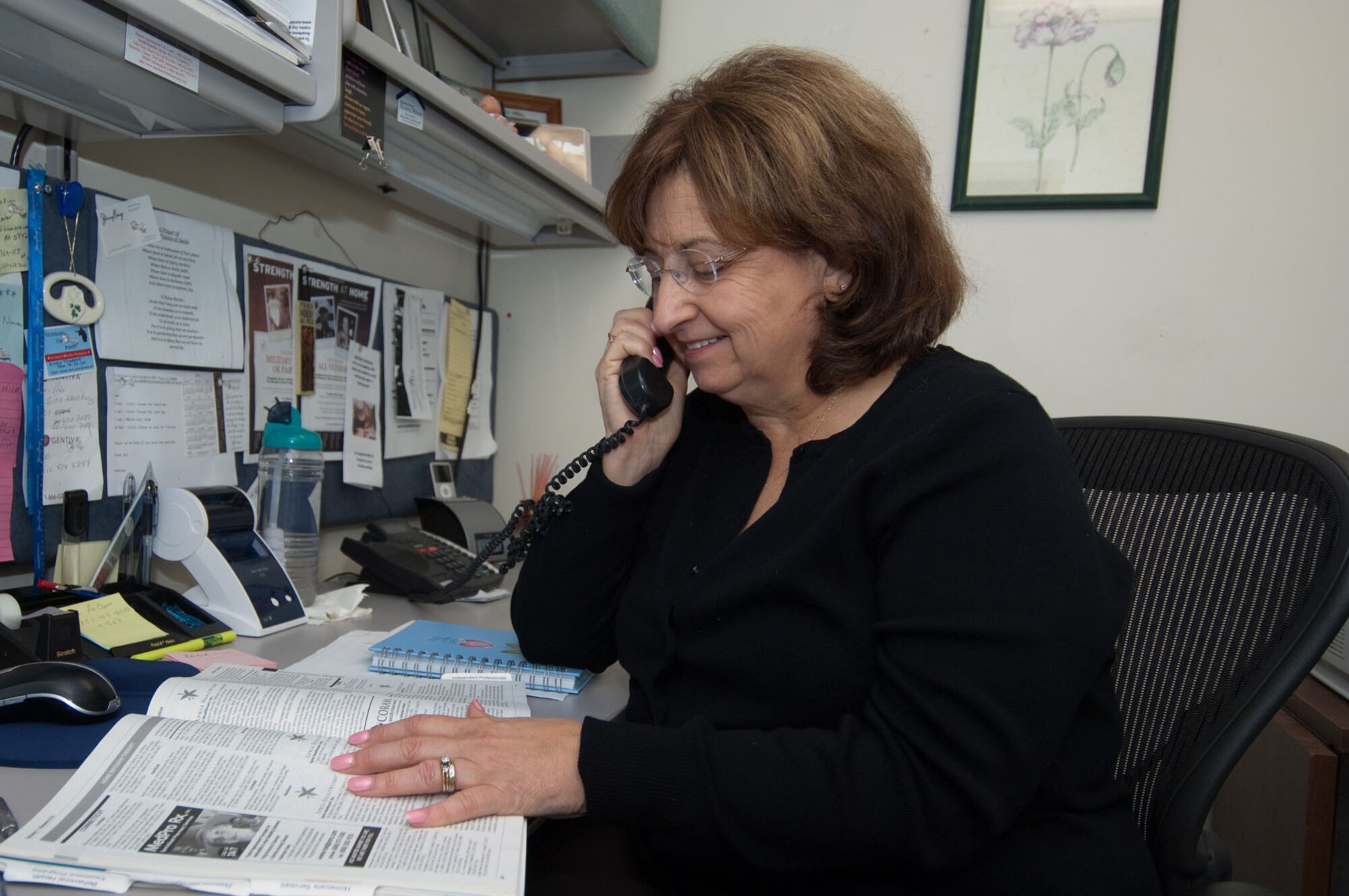 HANSCOM AIR FORCE BASE, Mass. – Donna Bibeau, clinical case manager for the 66th Medical Squadron, calls one of her many resources to help an active duty member returning from deployment. Bibeau works with a variety of military and non-profit organizations to help military members receive the treatment or resources they need to help make the transition from a deployment to active duty, home or civilian life. (U.S. Air Force photo by Rick Berry)