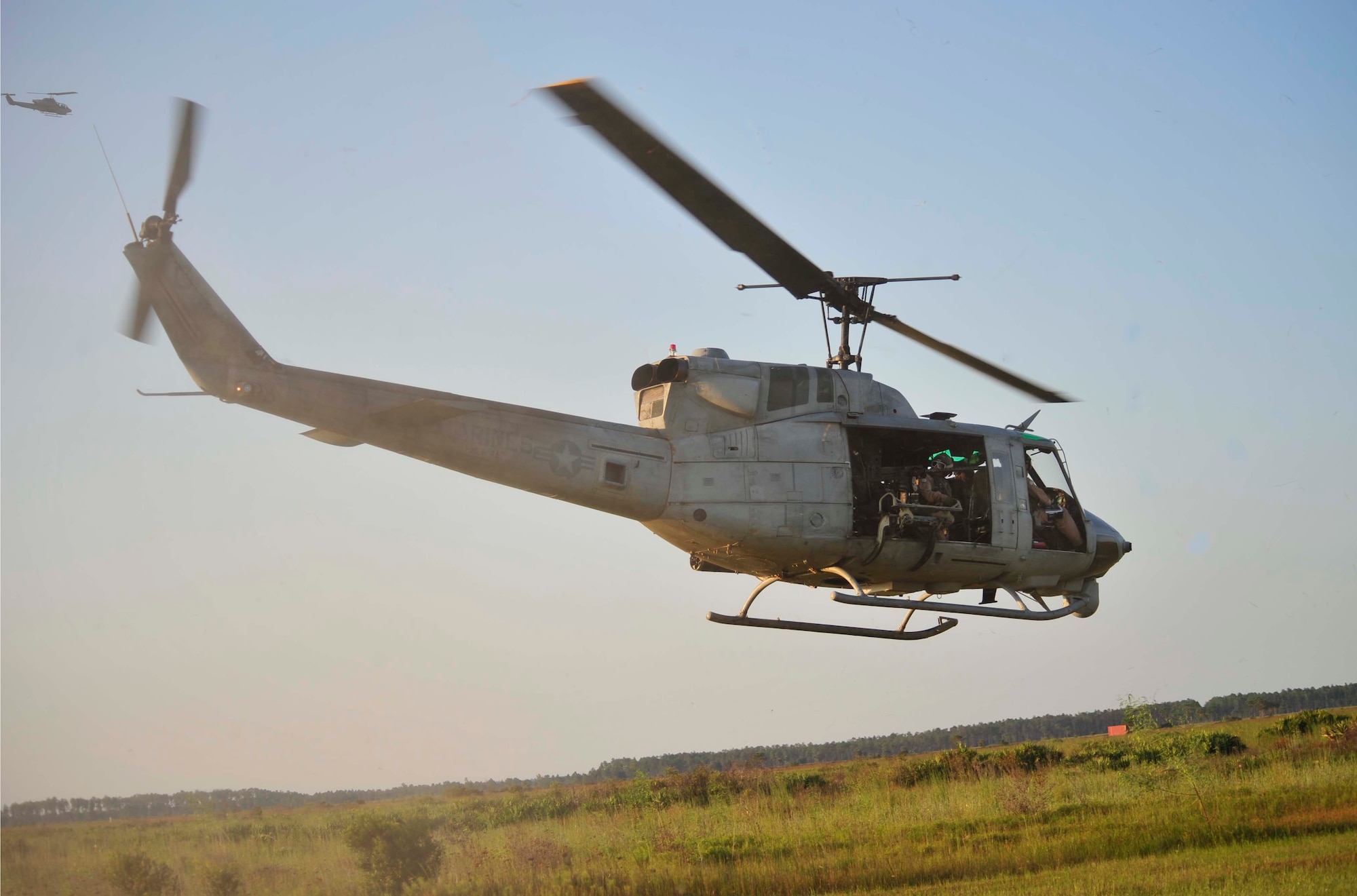 100914-F-4983M-222

AVON PARK, Fla. -- An UH-1 Huey and an AH-1 W Cobra patrol the sky overhead on Sept. 14, 2010 as part of Atlantic Strike 10-02. The helicopters are from Marine Light Attack Helicopter Squadron-467, Marine Corps. Air Station, Cherry Point, N.C. Atlantic Strike is a biannual Air Combat Command sponsored joint training exercise designed for the tactical employment of air power in support of joint terminal attack controller and joint fires observer integration through close air support. (Air Force photo/Staff Sgt. Patrick Mitchell)(RELEASED)


