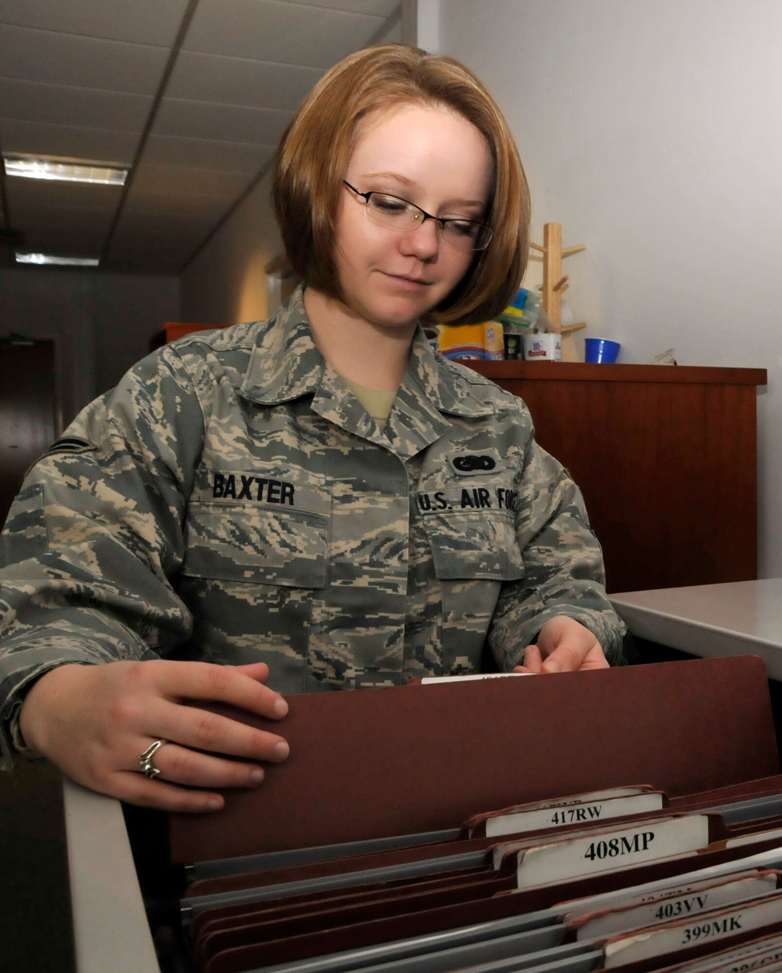 Airman 1st Class Samantha Baxter, 48th Logistics Readiness Squadron equipment accountability element journeyman, organizes equipment master jacket files for equipment custodians at RAF Lakenheath, England Sept. 15. Airman Baxter was nominated as a liberty Spotlight because she portrays the core value 'Service Before Self'. (U.S. Air Force photo/Airman 1st Eboni Knox) 