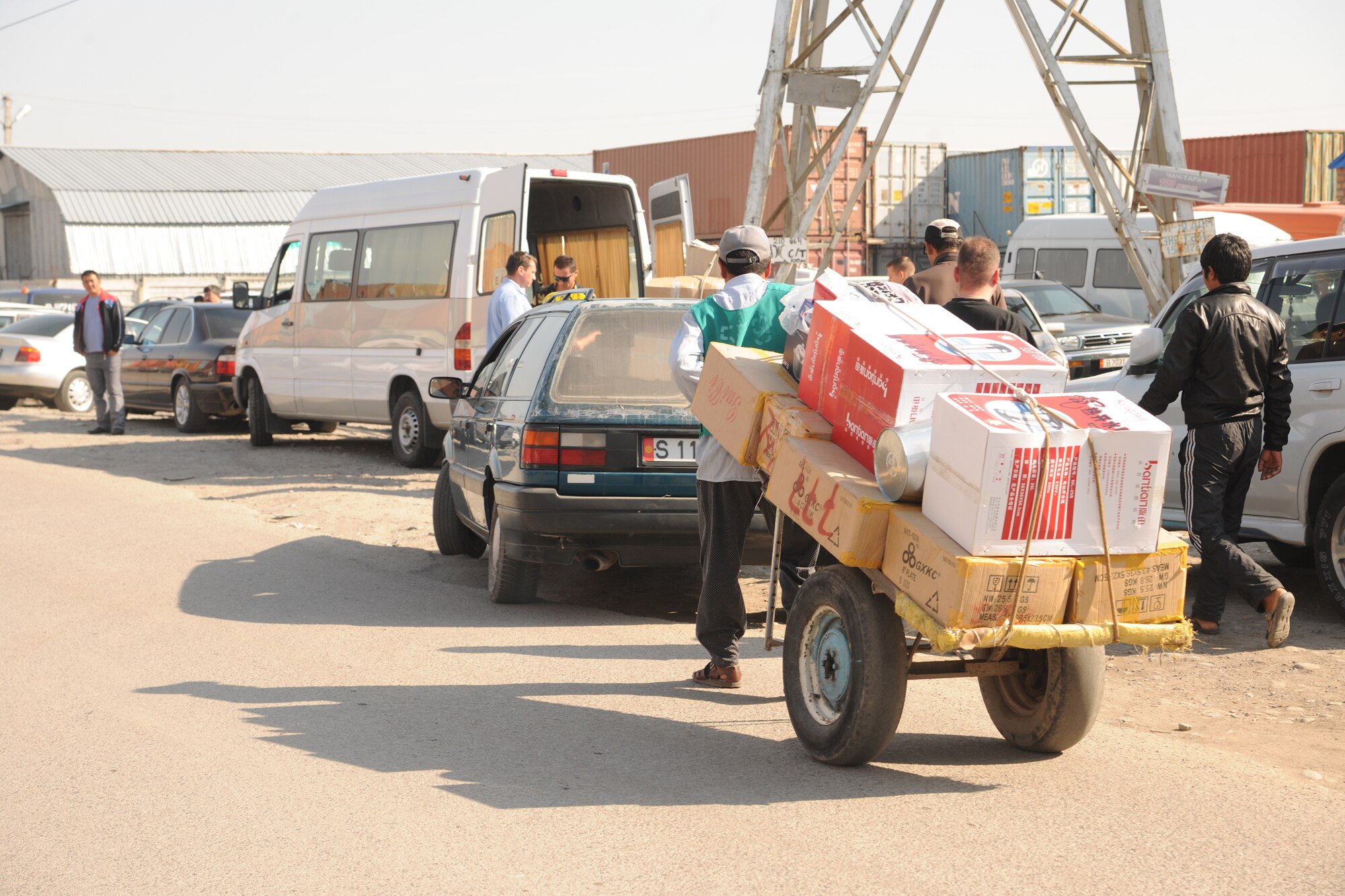 BISHKEK, Kyrgyzstan - School furniture is transported to awaiting Transit Center Airmen to load onto a bus for donation to Marble Kindergarten.  A total of $10,000 of supplies and furniture were donated.  (U.S. Air Force photo/Staff Sgt. Nathan Bevier)