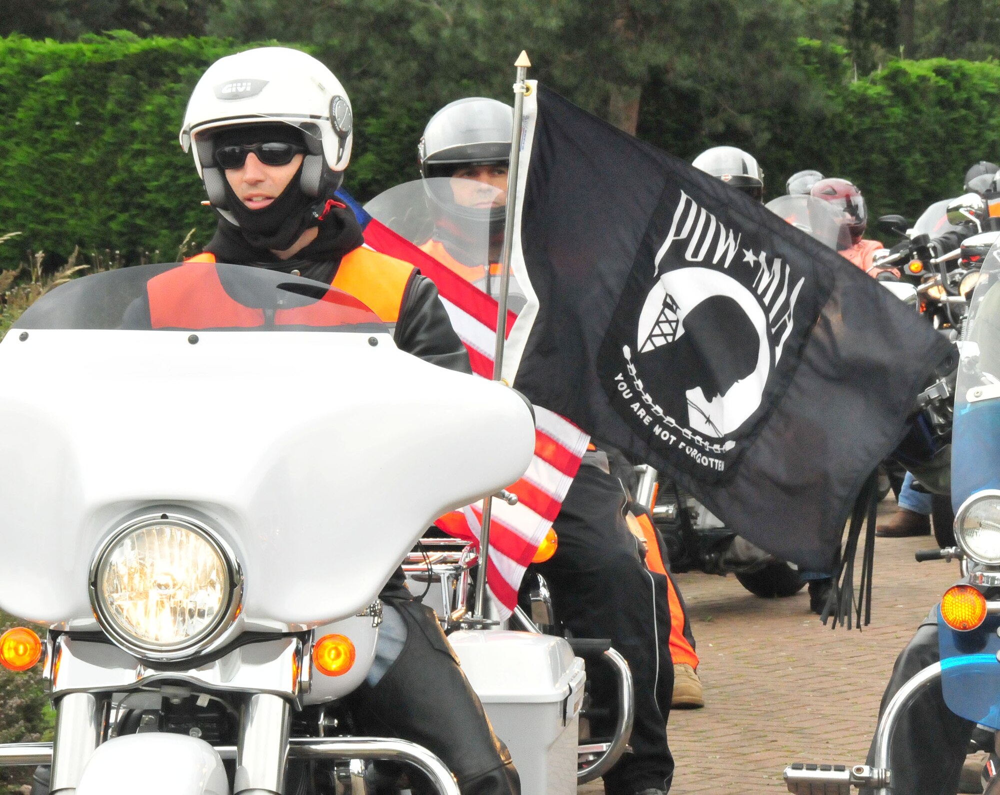 ROYAL AIR FORCE LAKENHEATH, England - A group of motorcyclists led by Tech. Sgt. Jonathan Richichi, 48th Communications Squadron infrastructure technician, participates in the "Rolling Thunder" memorial ride between RAFs Mildenhall and Lakenheath on Sept. 14. The ride was in observance of Prisoner of War/Missing in Action remembrance week. Riders laid wreaths at war memorials along the route. (U.S. Air Force photo/Staff Sgt. Connor Estes) 
