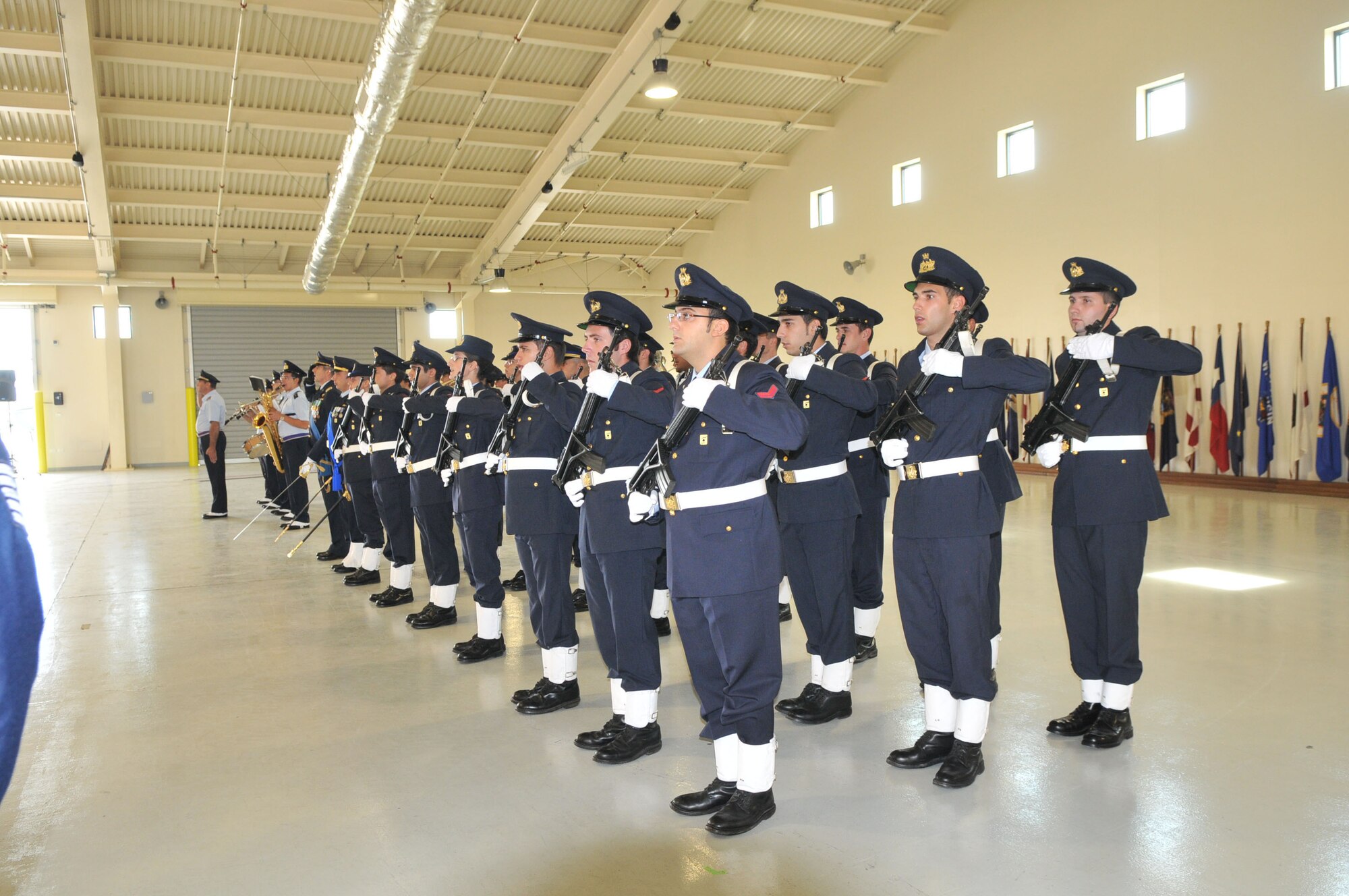 Members of the Italian air force Honor Guard salute during a change of command ceremony at the Personnel Alert Holding Area Sept. 15. (U.S. Air Force photo/Staff Sgt. Mercedeskimble L. Crossland)