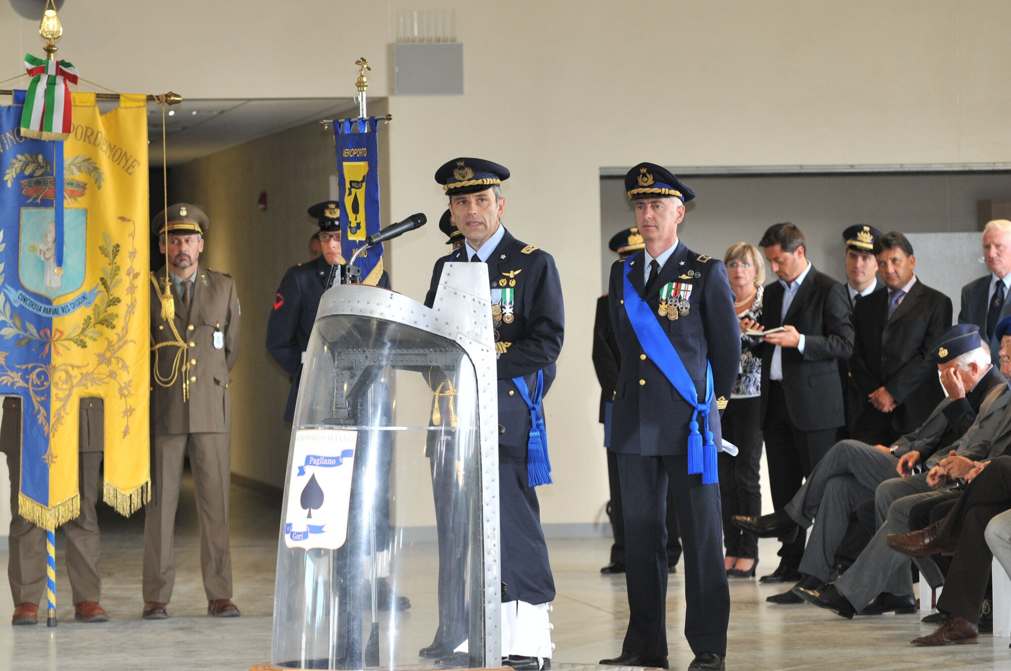 Col. Filippo Zampella gives his farewell speech prior to relinquishing command of the Italian Air Force "Pagliano e Gori" Airport, to Col. Luca Cappelli, during a change of command ceremony at the Personnel Alert Holding Area Sept. 15. Colonel Zampella will be heading to the Italian Air Force Academy in Pozzuoli, Naples. (U.S. Air Force photo/Staff Sgt. Mercedeskimble L. Crossland)