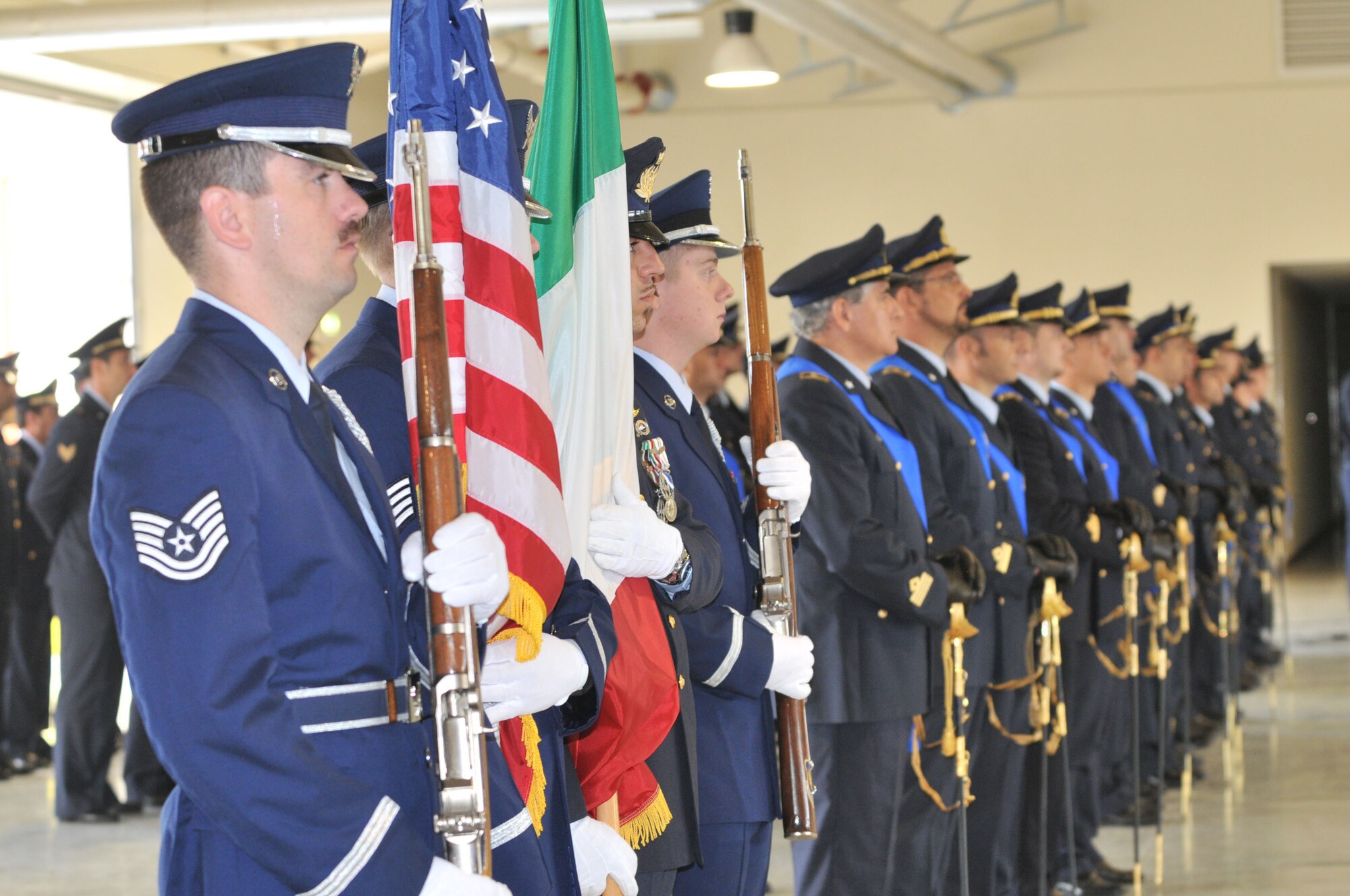 Members of Aviano Air Force Honor Guard and Italian air force participate in an Italian change of command ceremony at the Personnel Alert Holding Area Sept. 15. (U.S. Air Force photo/SSgt Mercedeskimble L. Crossland)